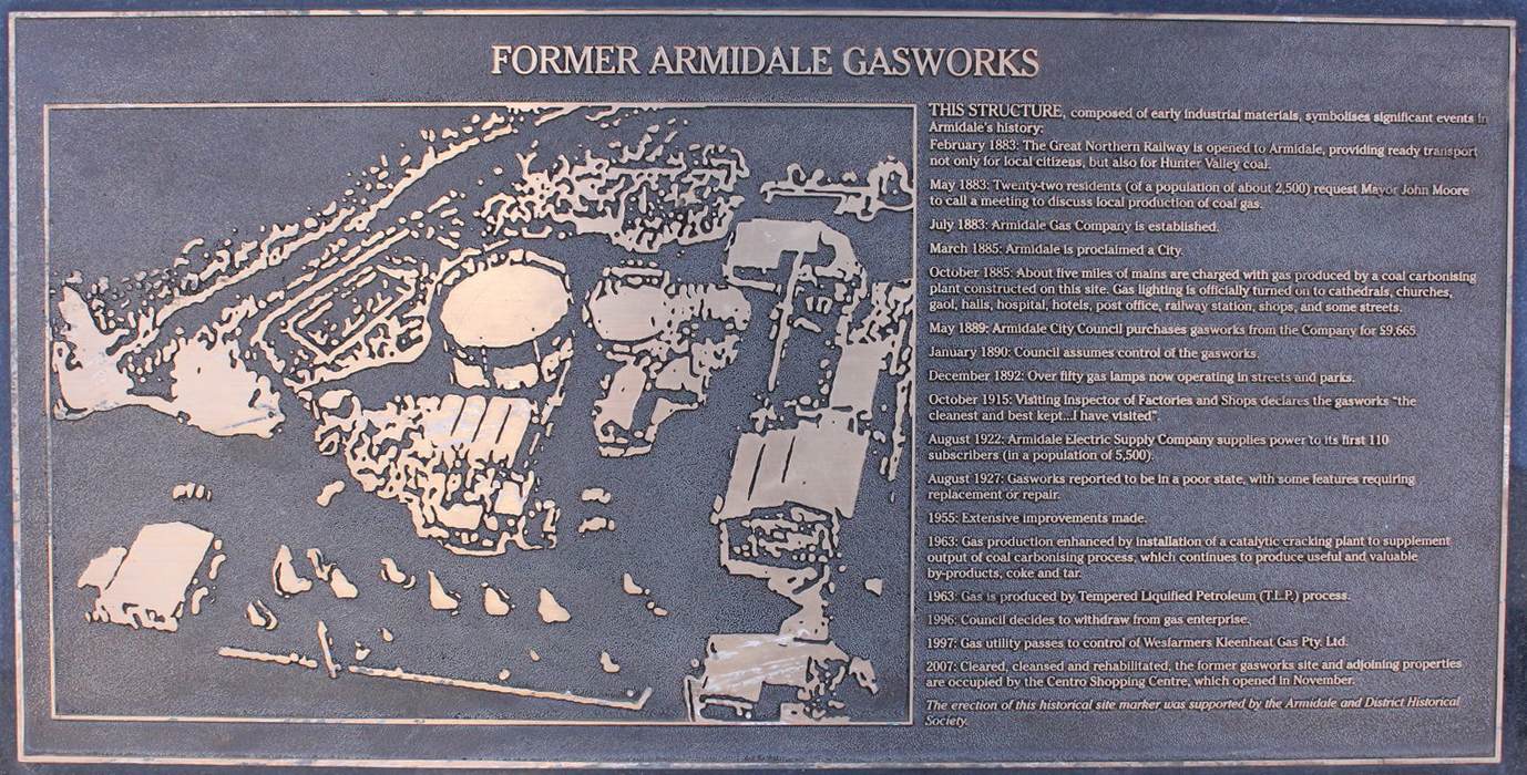 Plaque below sculpture noting position of old gas works