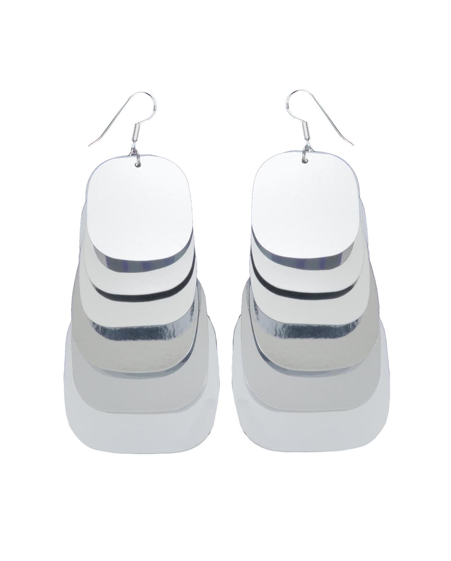 A pair of silver multi-layered statement earrings with sterling silver hooks. Each lightweight earring features multiple overlapping oval shapes.