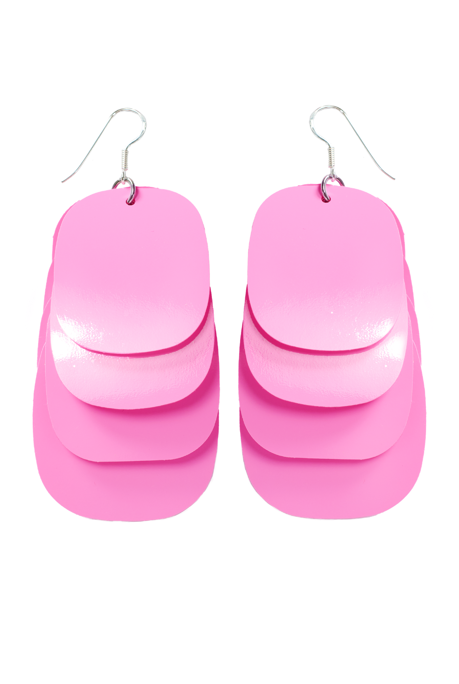 A pair of glossy pink multi-layered statement earrings with sterling silver hooks. Each lightweight earring features multiple overlapping oval shapes.