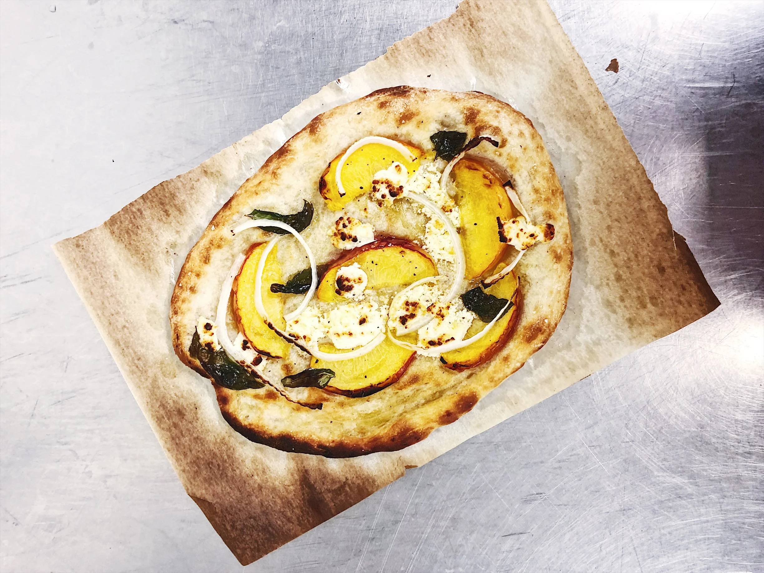 Peach basil flatbread with goat cheese and onions. No explanation. Just delicious.