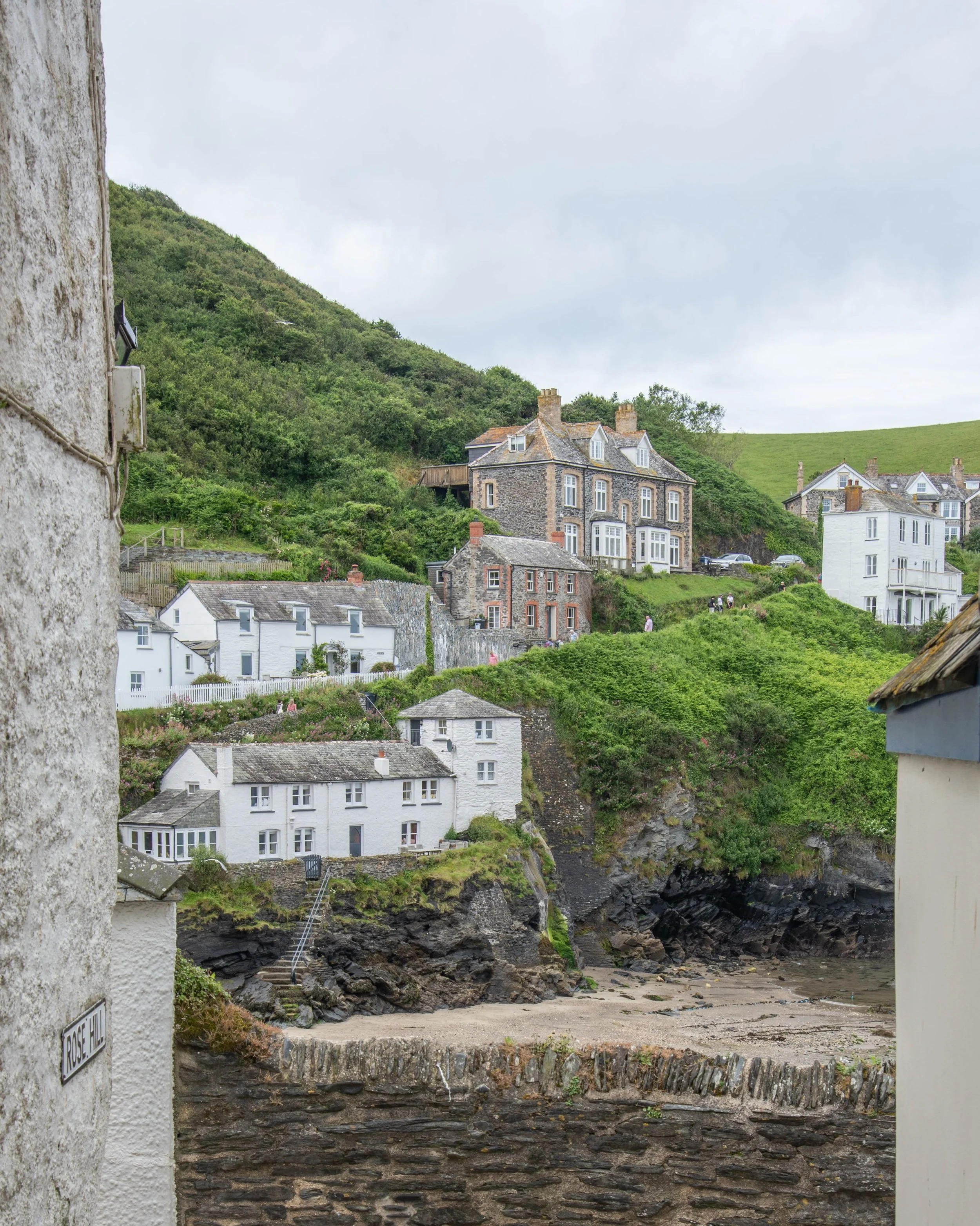 Port Isaac cottages 
The architecture here was dictated entirely by history and geography. Because space in the steep ravine leading down to the harbor was limited, builders packed the cottages together tightly to protect them from the harsh Atlantic
