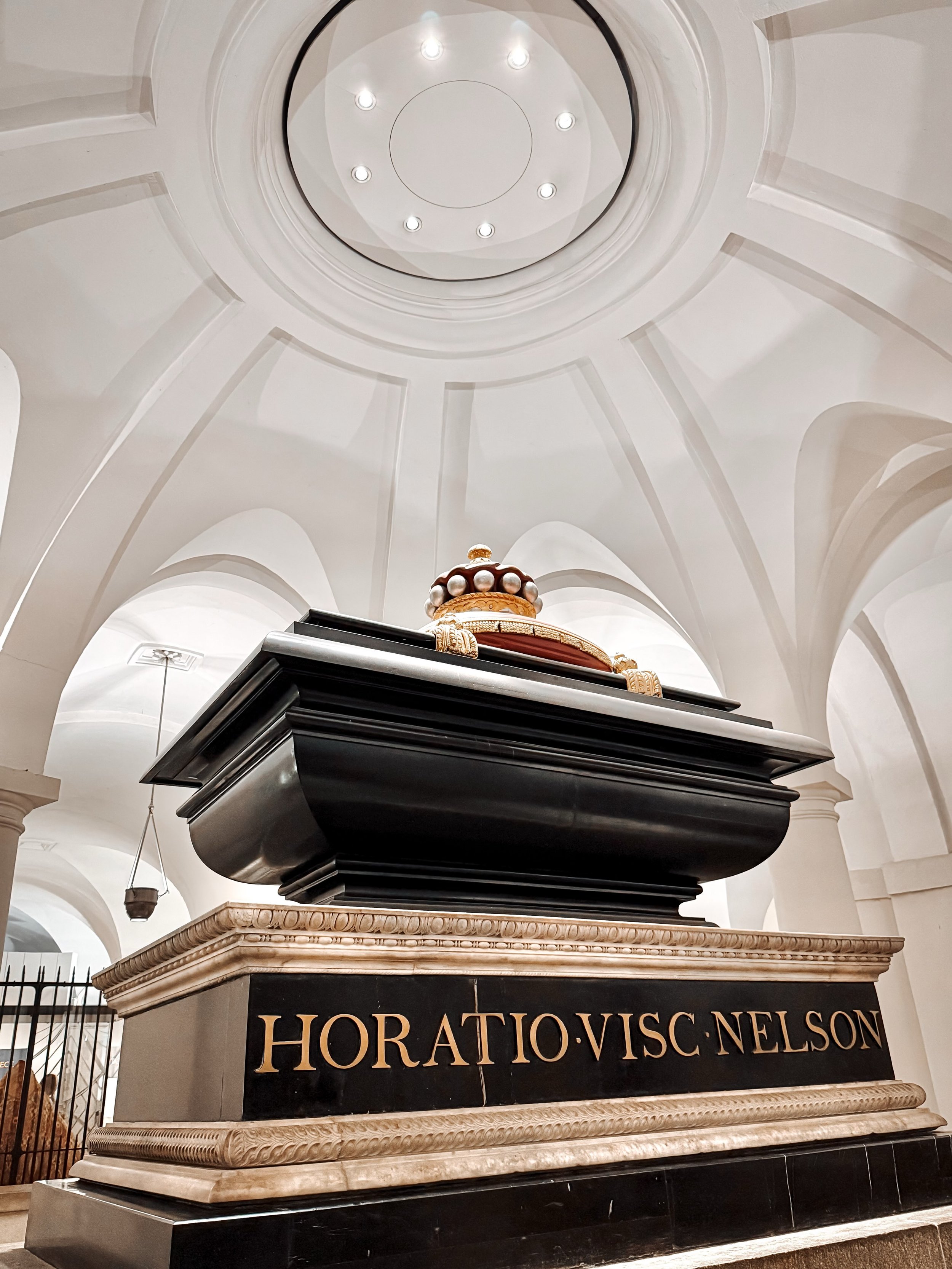 Located in the crypt of St Paul&rsquo;s Cathedral directly beneath the Great Dome, the tomb of Admiral Lord Horatio Nelson is a grand, imposing monument steeped in royal and naval history. At its centerpiece is a dark, polished black marble sarcophag