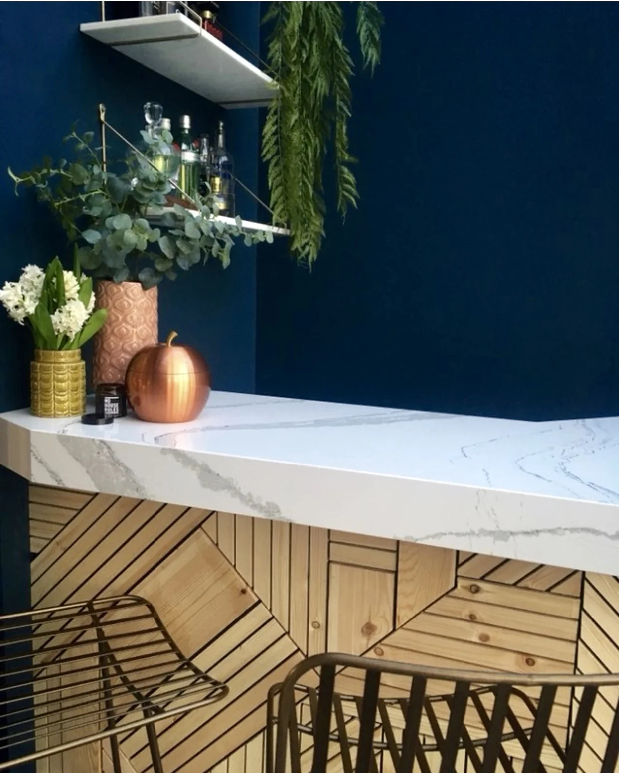 I love the classic marble counter top Donna has added against the geometric wood pattern on the bar.... Midas bar stools Rockett st George ....... Hague Blue wall paint Farrow & Ball