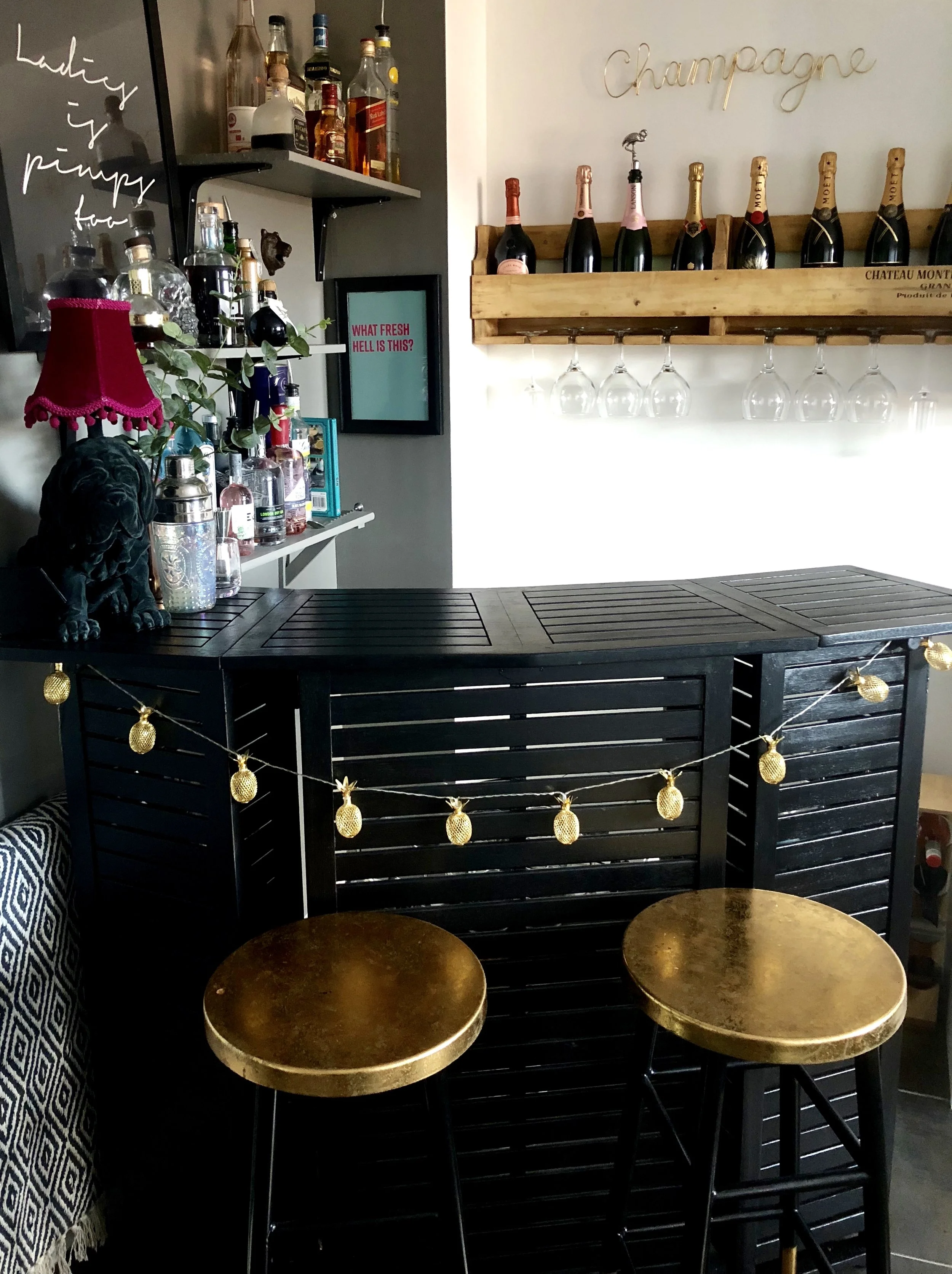 Beth's bar in the corner of her kitchen is from Wayfair.co.uk, she painted it in Farrow & Ball 'Pitch Black' and added gold accents..... you can see more of Beth's home on her home tour HERE @bethshehata