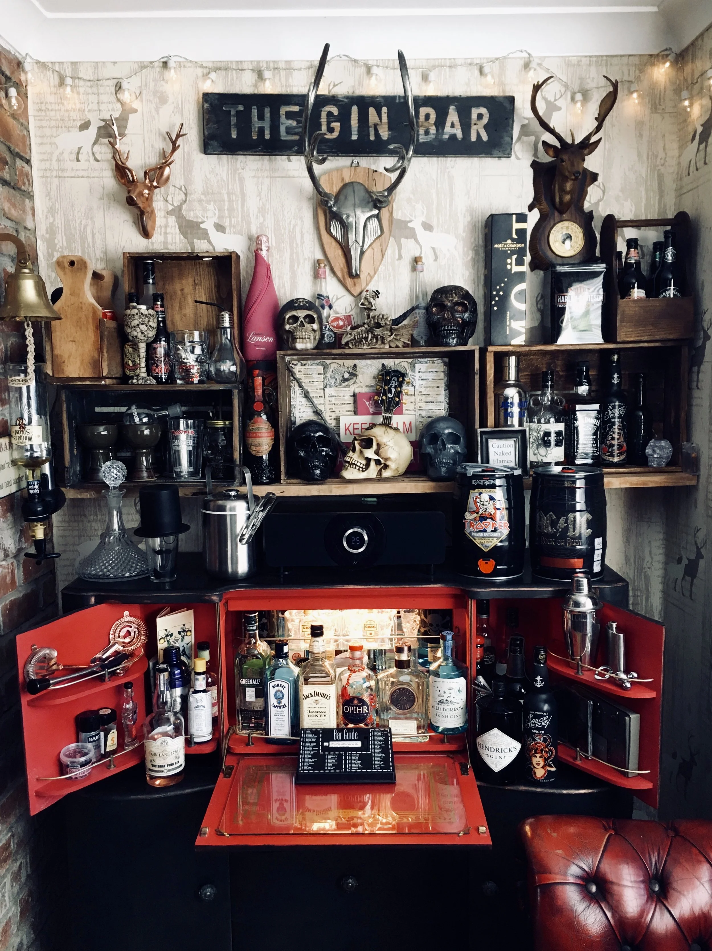 Kelly's bar area in her home even has its own name 'The Dirty Dog'..... She bought a cocktail cabinet and painted the inside red and got the lights working again to make this fabulously gothic home bar area @tyambyth