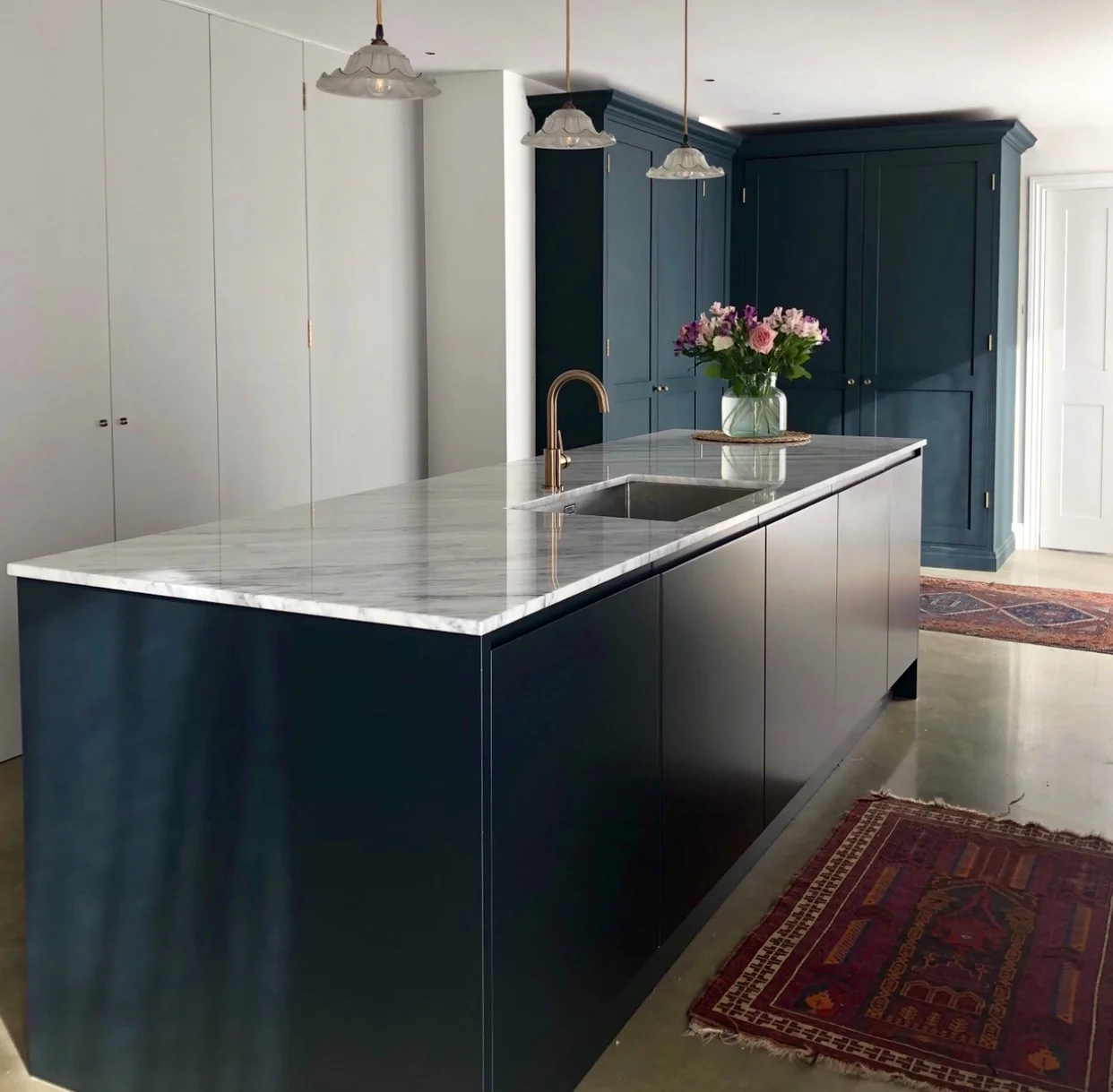 I love that everything is hidden away in Michaela’s kitchen so it looks beautiful and sleek….. Oh and of course those concrete floors!