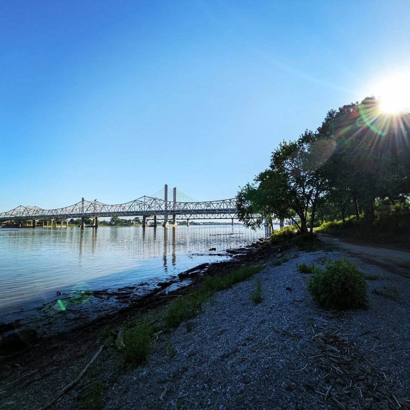 &bull;&bull;&bull;
And the River said,
"I am here.
Witness my expanse and sparkle. 
See how the wind lifts only the gentlest ripple on my surface, the slightest texture to my flow.
On a clear, bright morning, my movement is nearly imperceptible 