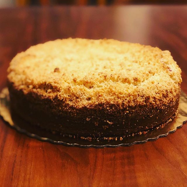 An strawberry-rhubarb coffee cake with almond black pepper streusel. Part of a larger party spread to celebrate a 70th birthday for TWIN sisters. Pictures never do justice to aroma and flavor! (Cutting would help but customers tend not to appreciate