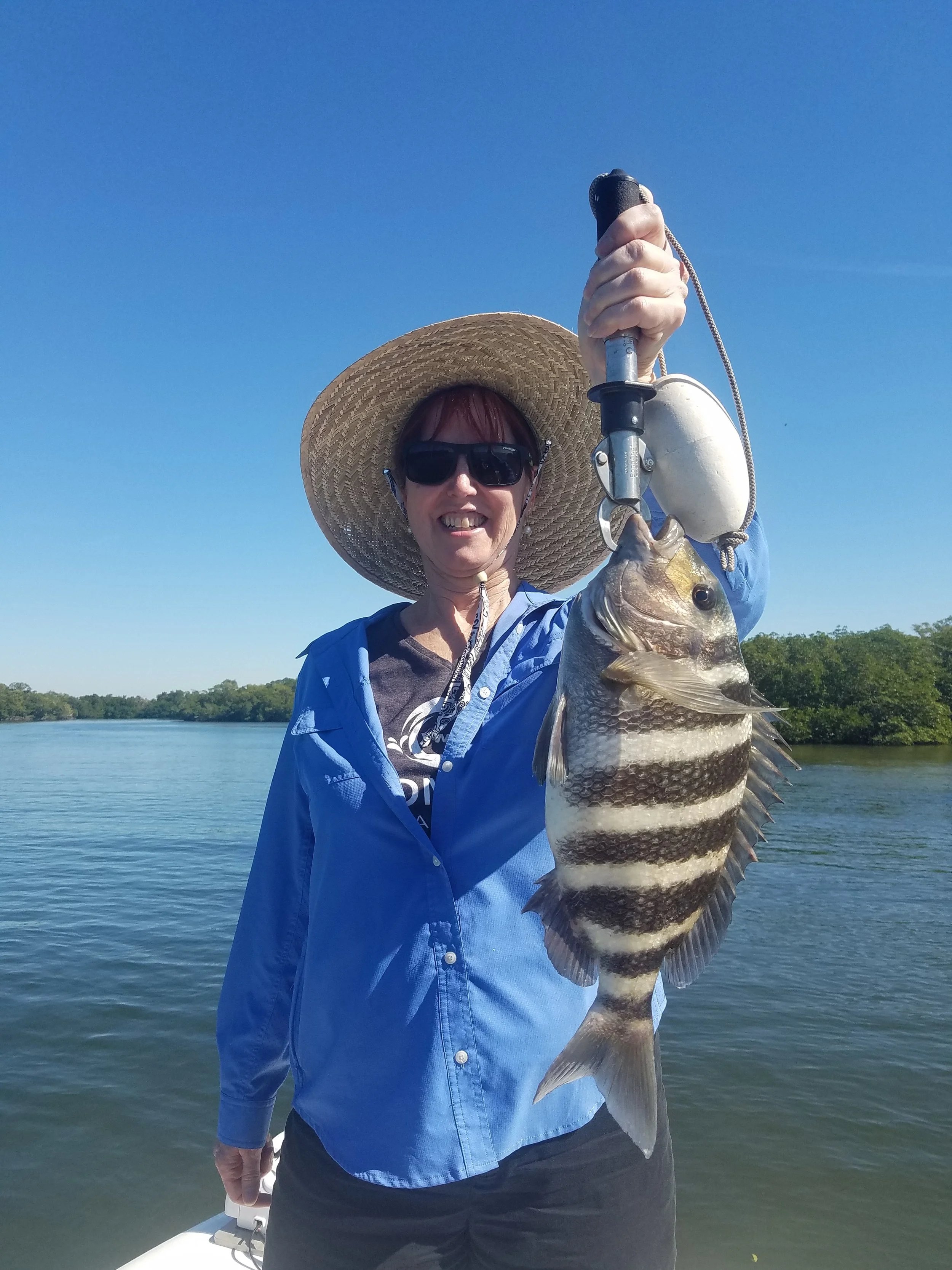 Carolyn with her personal best sheepshead fishing aboard Chum Crazy Charters in Fort Myers.
