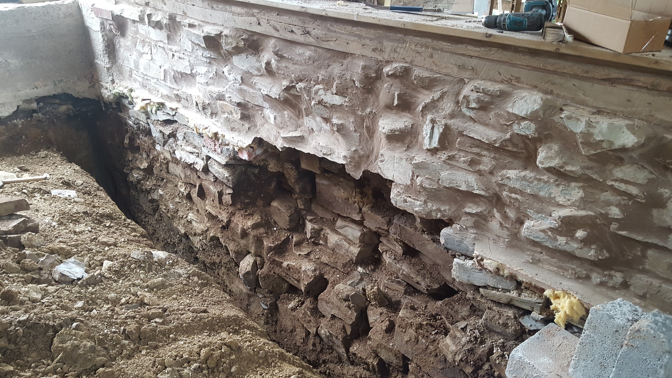 The original stone wall on one of the bedrooms - just before insulating