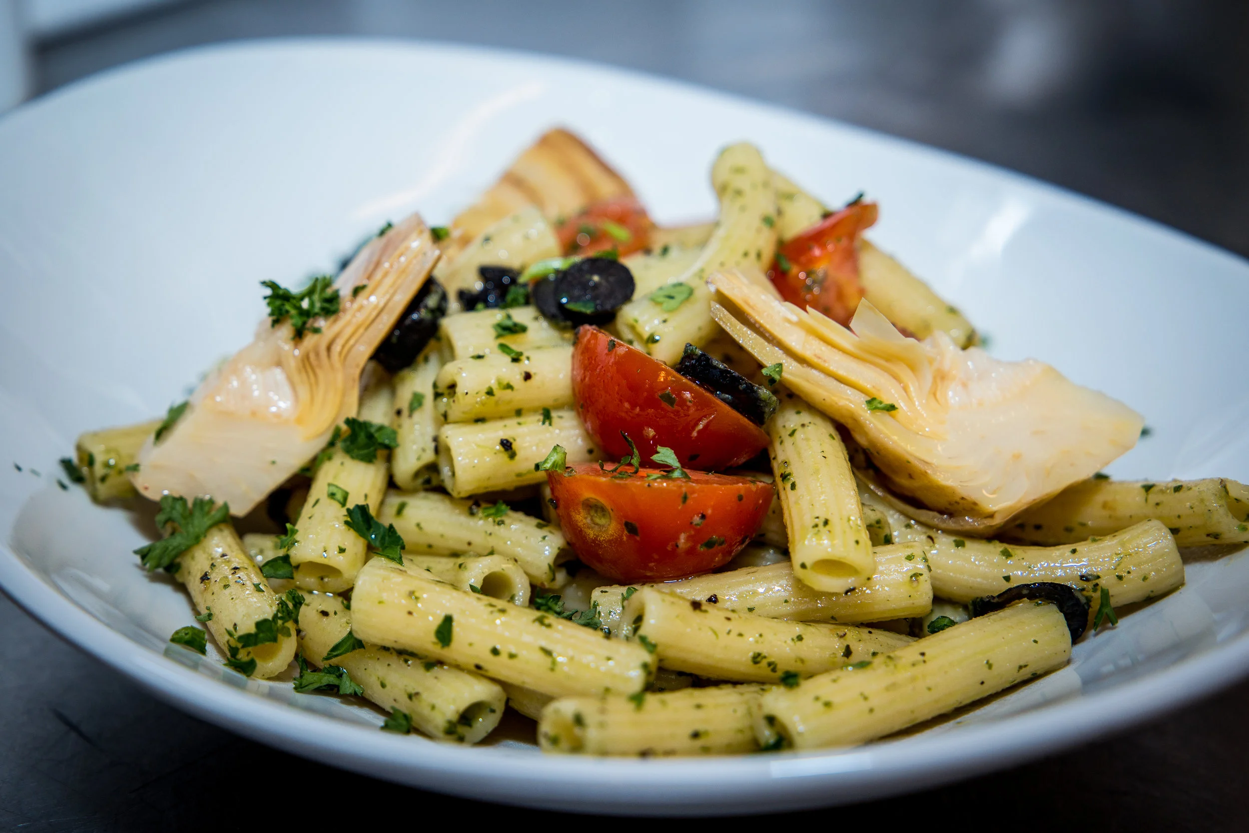 Vegan Special: home made mint and basil pesto with artichokes, olives, and cherry tomatoes.
