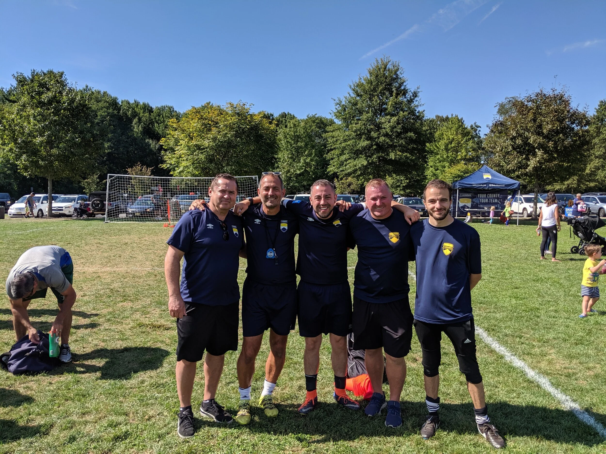 Professional coaches working with hundreds of kids at the Fair Haven rec program