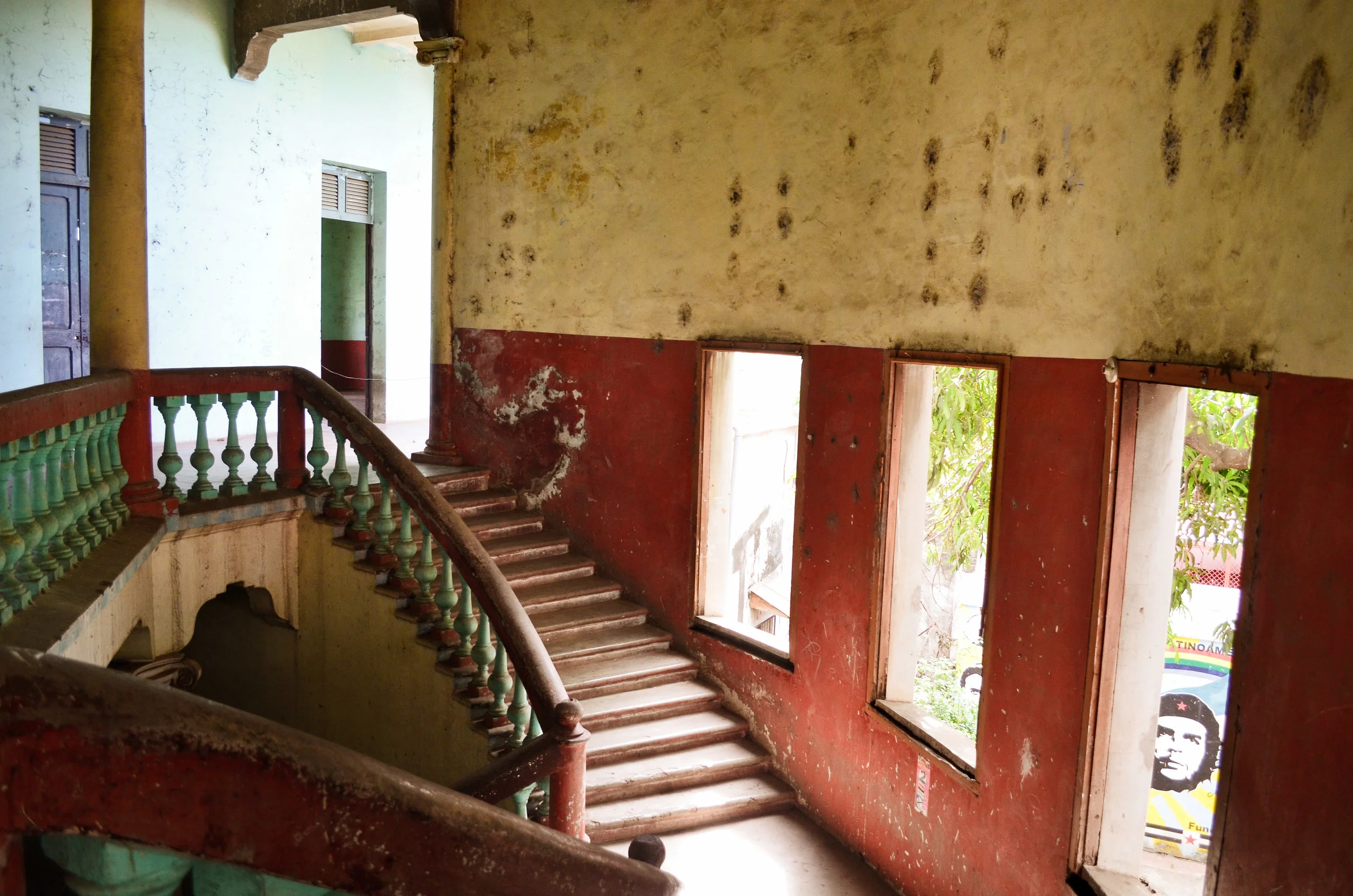 Bullet holes riddle the walls of the Museum of the Revolution, and a mural of Che Guevara peeks in through a window