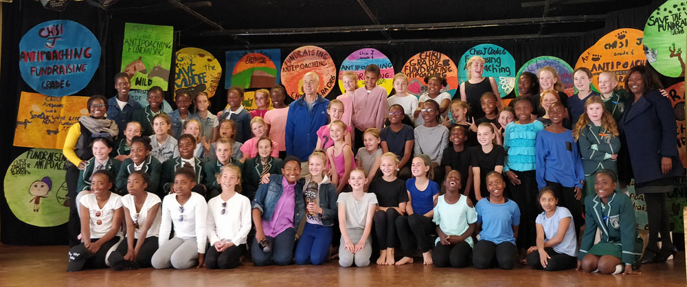 Zambezi Society Strategic Director, Richard Maasdorp (centre left in blue) and the Grade 6 classes of Chisipite Junior School Harare, and their teachers, who raised money for anti-poaching in 2019.