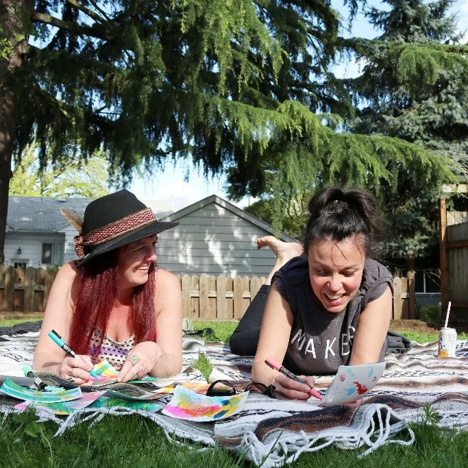 Artist friends Julz Nally and Consu Tolosa , supporting each other.