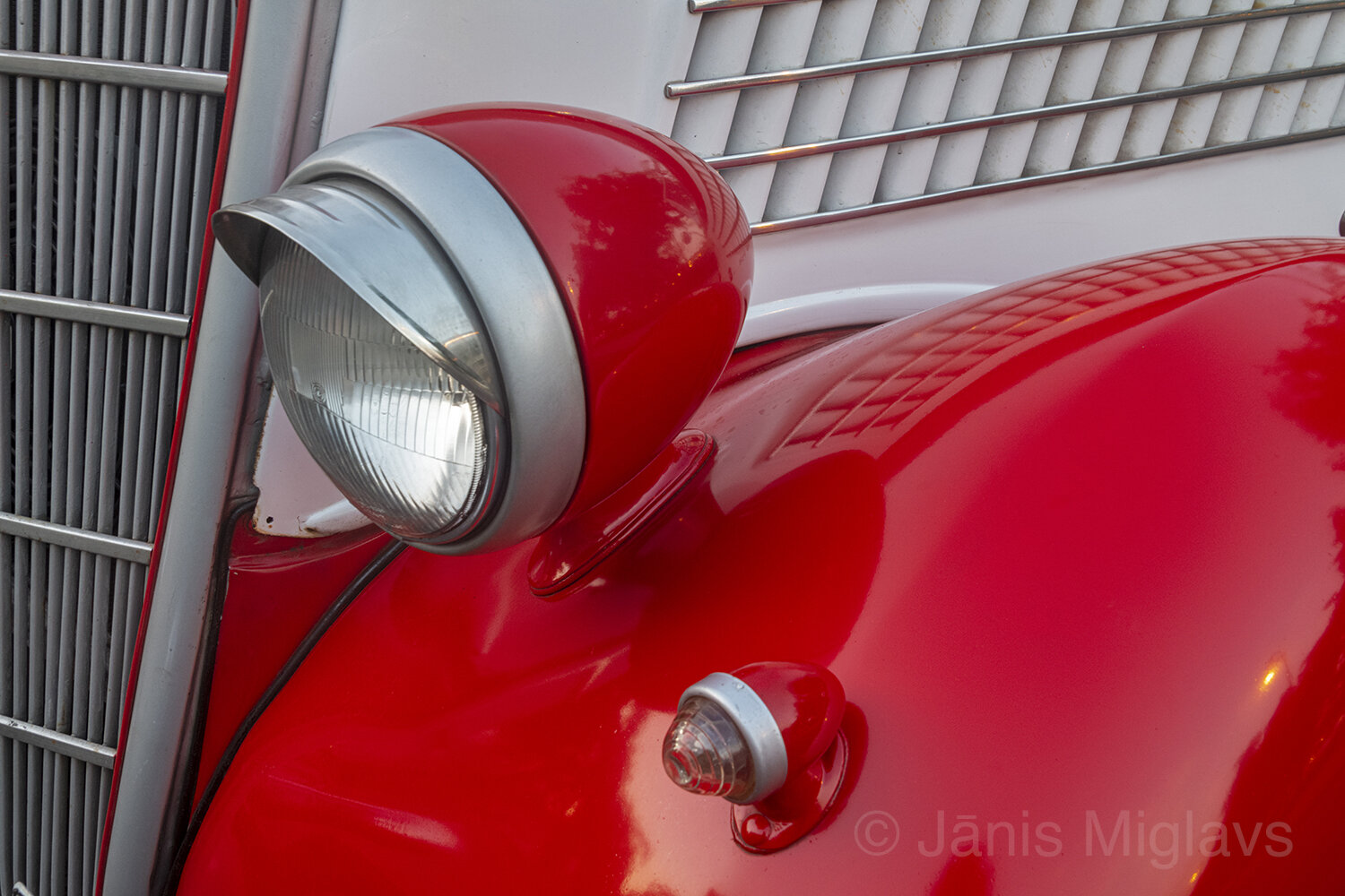 Headlamp on red fender