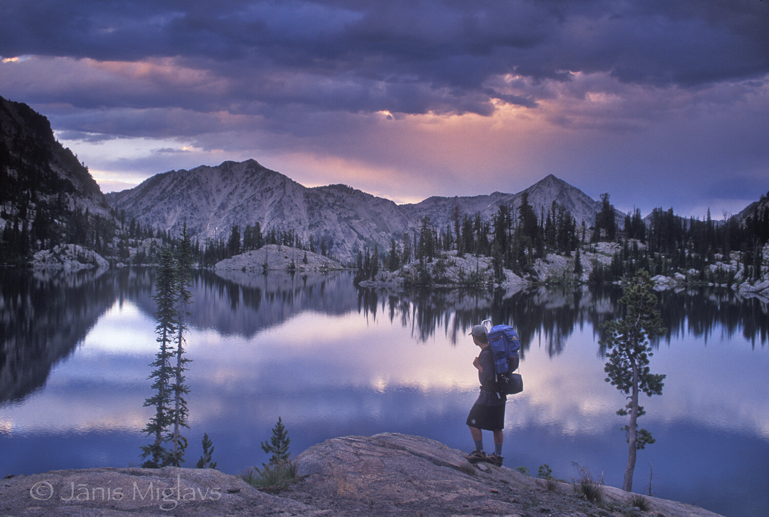 Hiker at sunset in Oregon's Wallowa Mountain Wilderness 