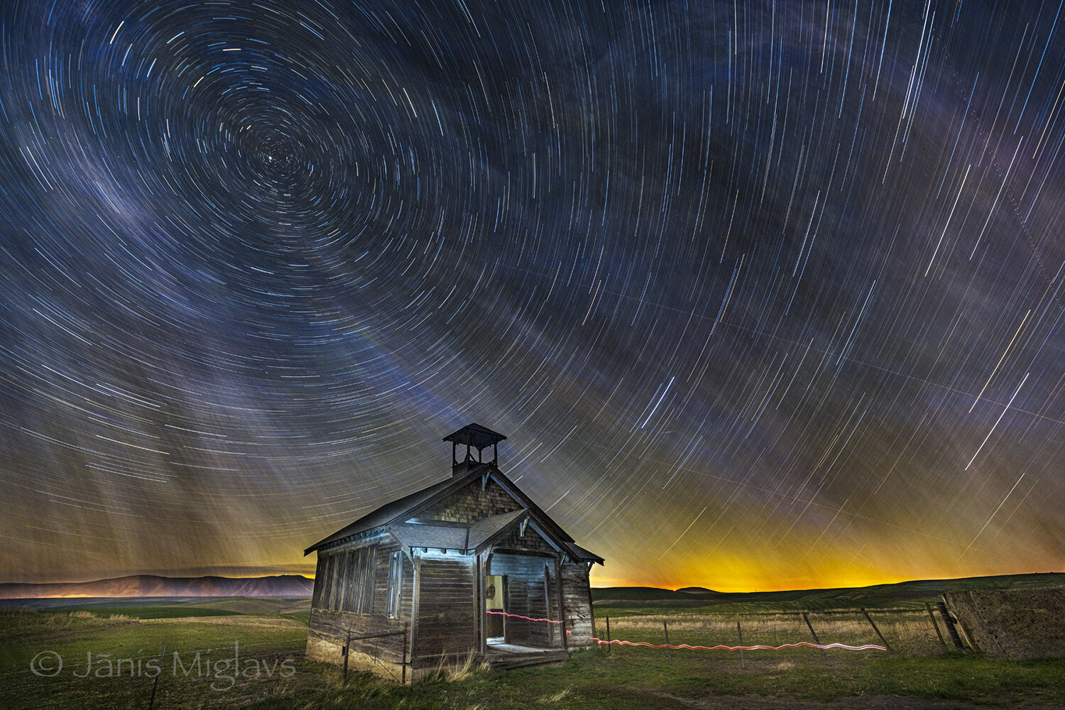 Abandonded schoolhouse under starry Oregon night