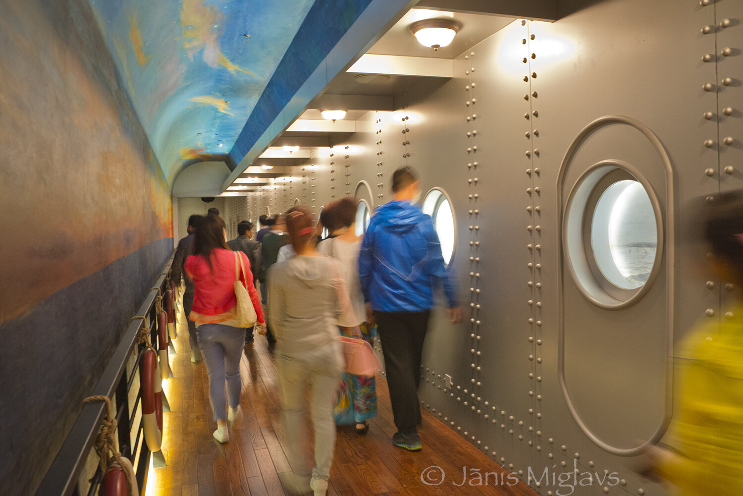 Chinese tourists go through a ship-like hall out of the winery visitor center.