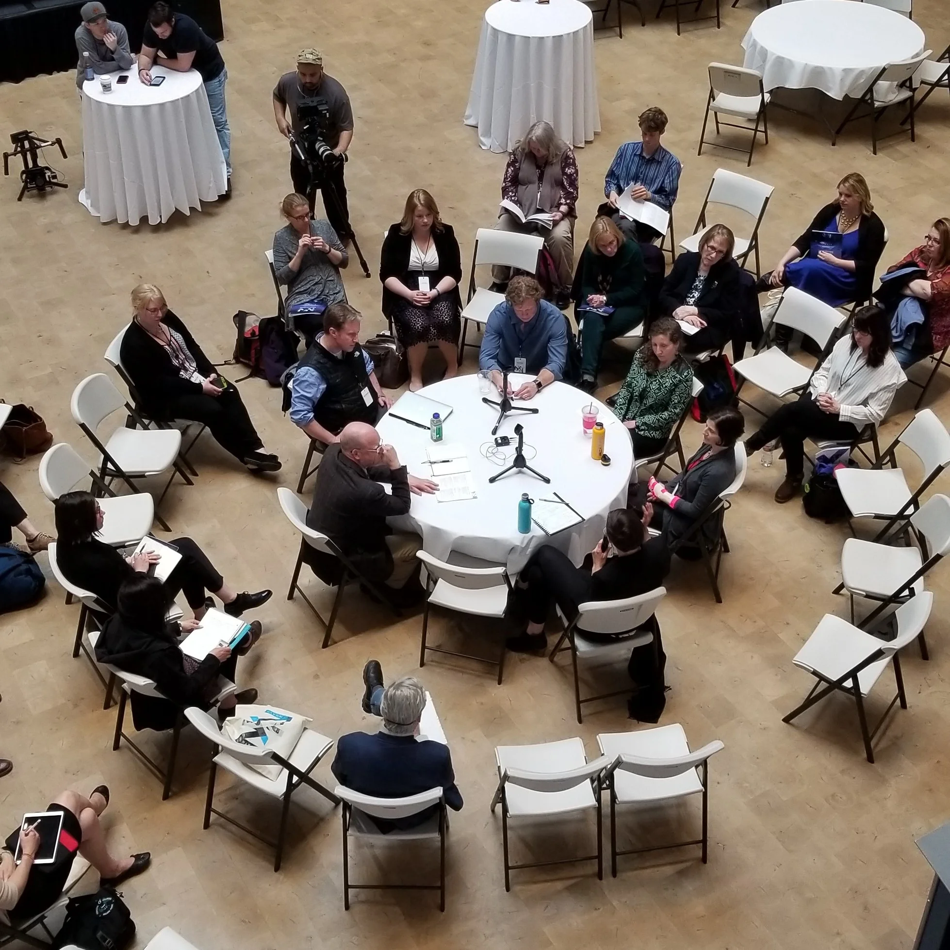 Panelists and participants in the North by North Festival gather in the Anchorage Museum atrium for a group "fishbowl" conversation.