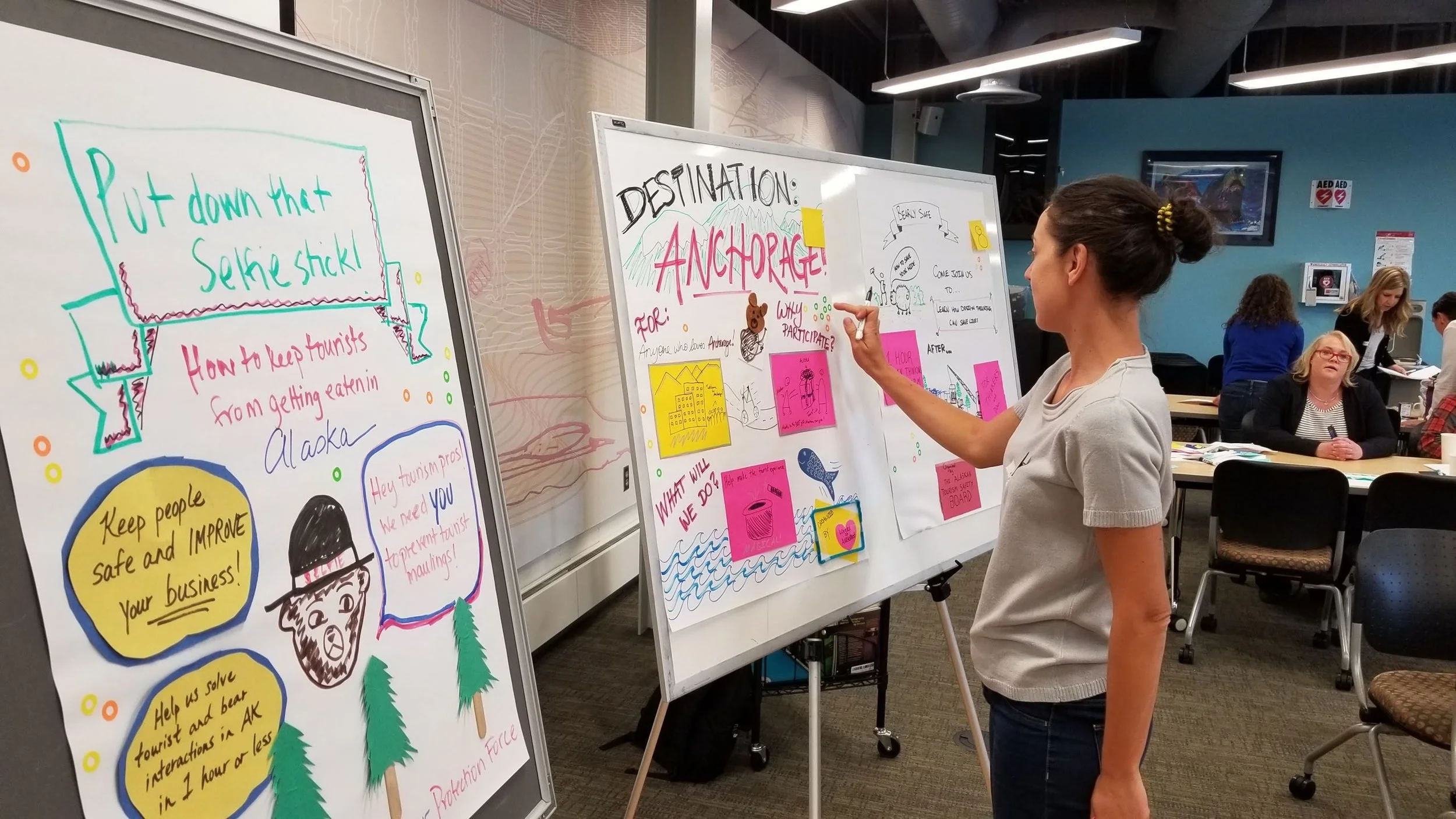 Elina Zheleva adds comments to a whiteboard during the Design Dash