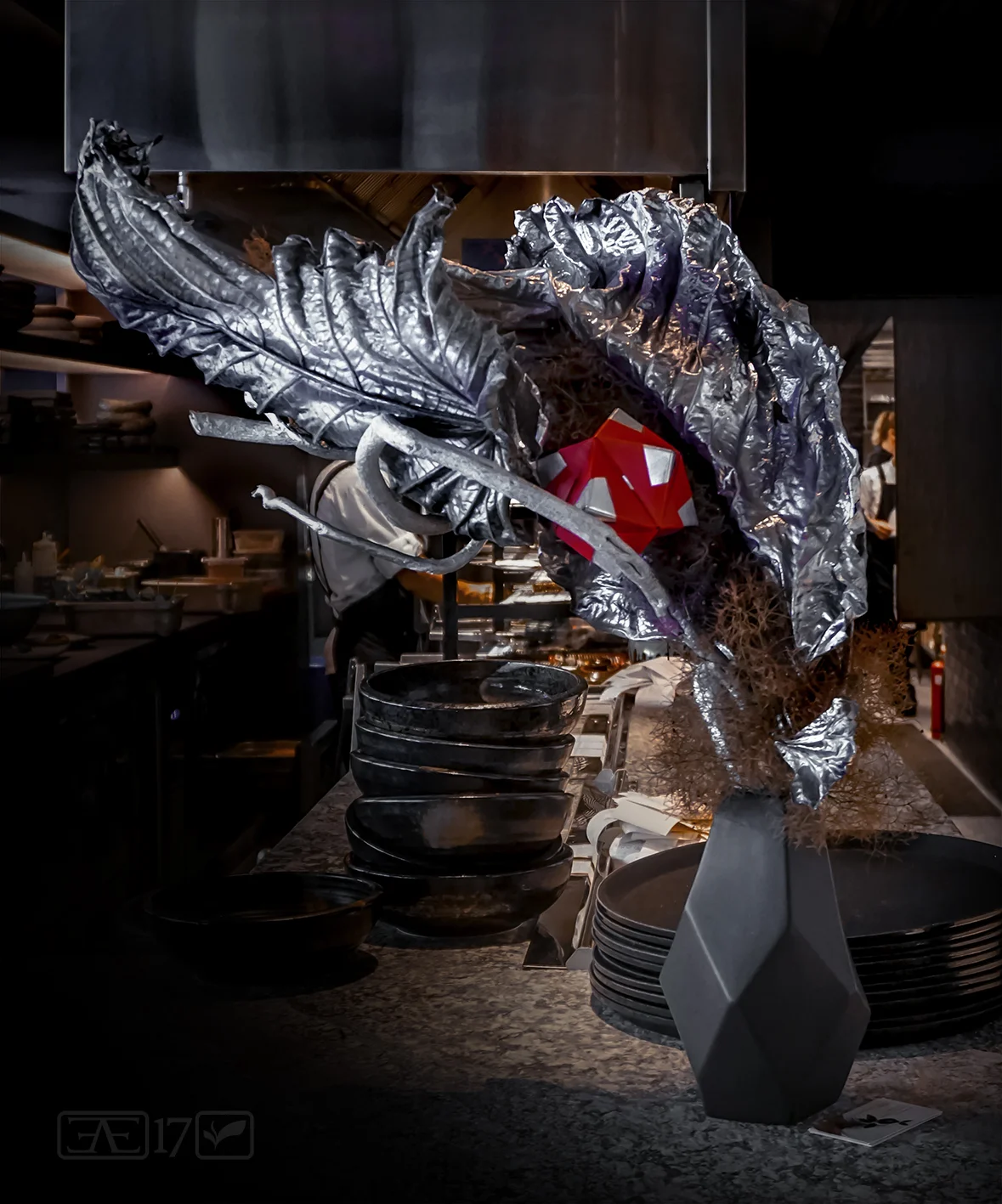 Arrangement at corner of kitchen bar - Use of dried or painted materials (giant fig leaf, wisteria branch & smoke bush) and unconventional materials (origami sonobe ball)