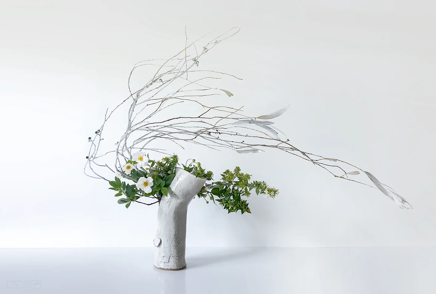 Arrangement showing movement - Blowing/sweeping. (Container by Alexander Evans.)