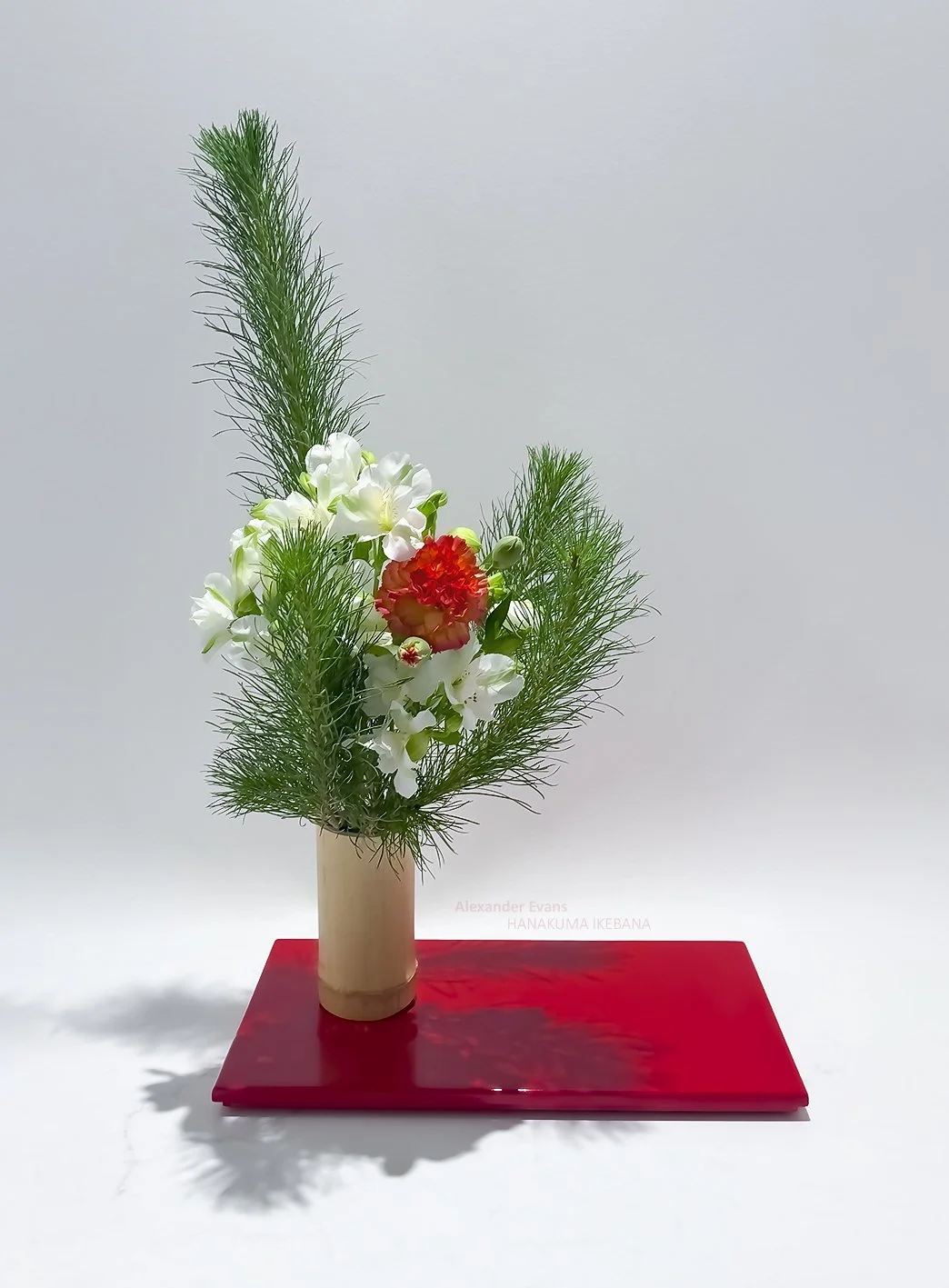 Pine alstromeria and carnation in bamboo container.jpg