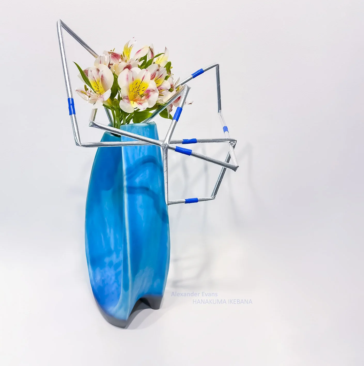 Silver straw structure with Alstromeria in Turquoise vase.jpg