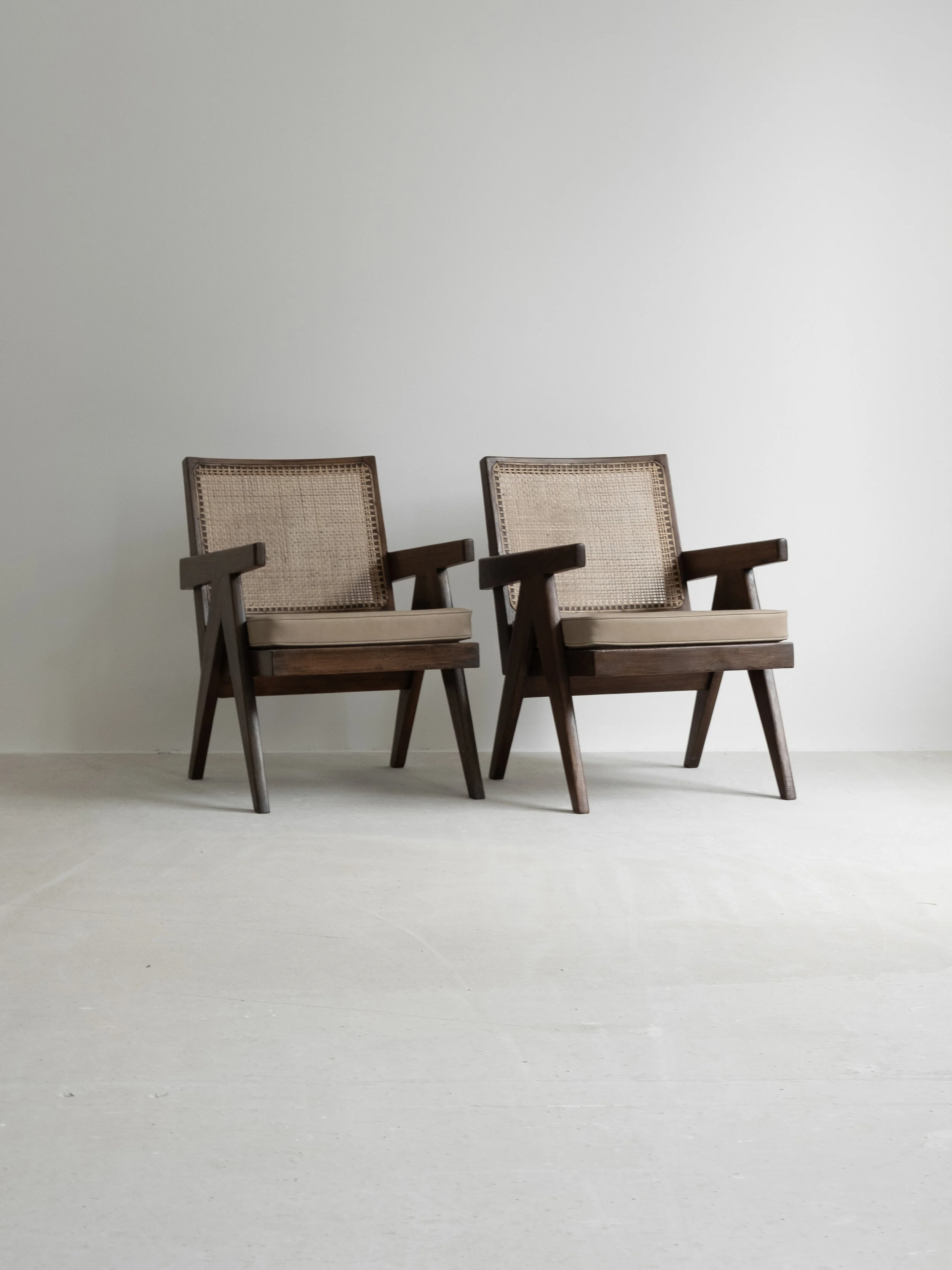 Vintage pair of Pierre Jeanneret “Easy Armchair” PJ-SI-29-A available at NICOLAI HECHT. Collectible, contemporary and vintage design available.
