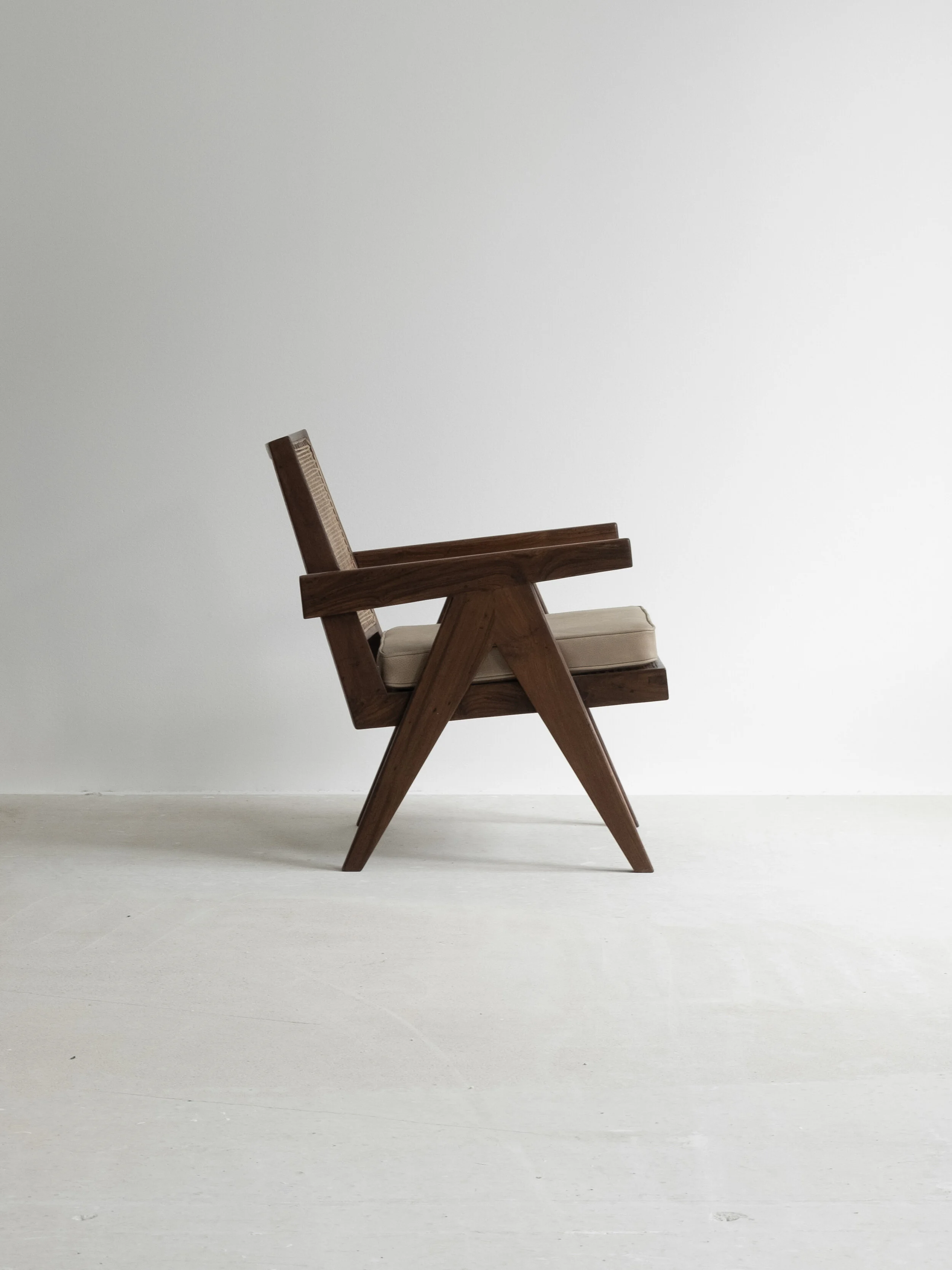 Vintage pair of Pierre Jeanneret “Easy Armchair” PJ-SI-29-A available at NICOLAI HECHT. Collectible, contemporary and vintage design available.