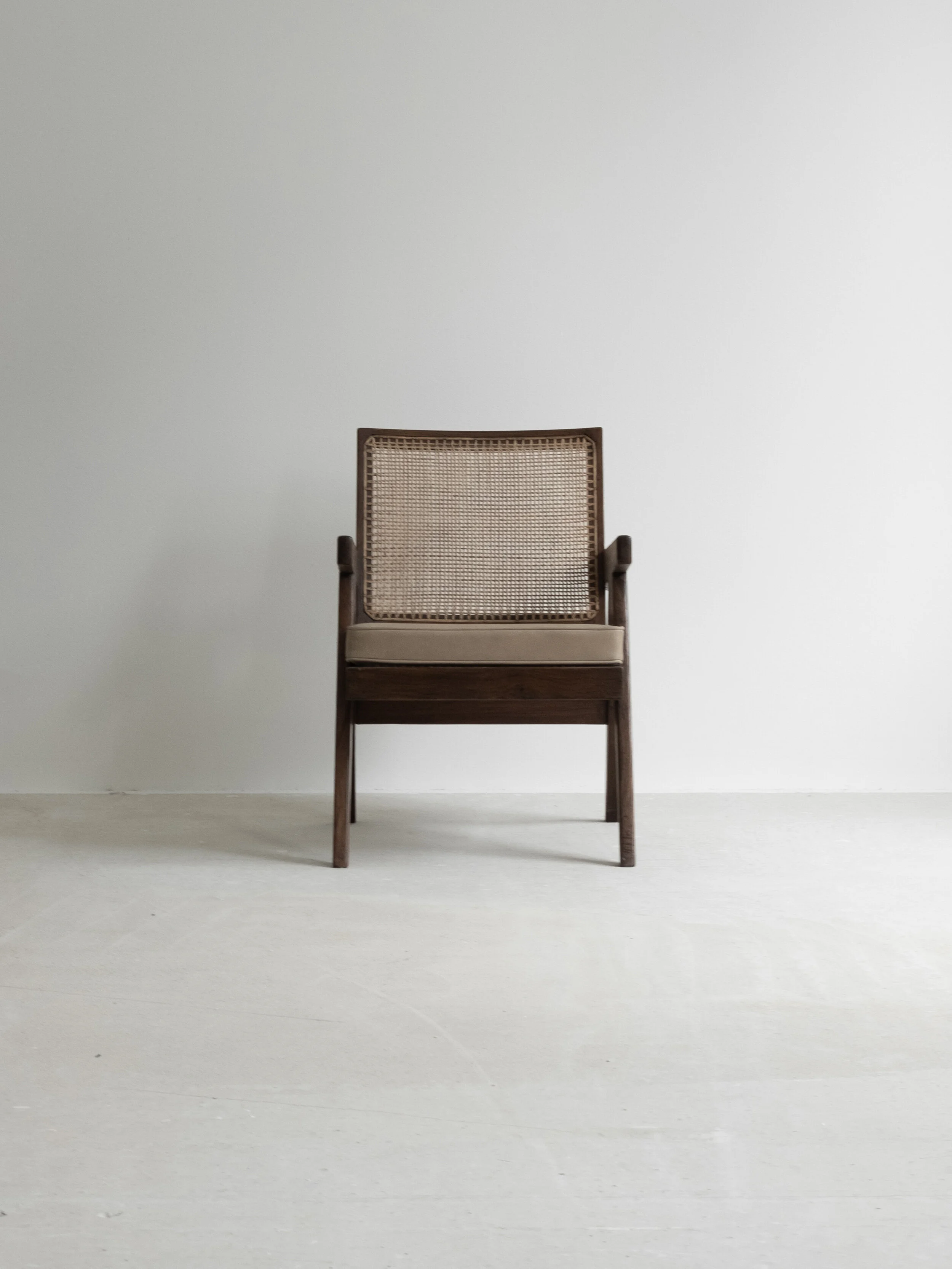 Vintage pair of Pierre Jeanneret “Easy Armchair” PJ-SI-29-A available at NICOLAI HECHT. Collectible, contemporary and vintage design available.