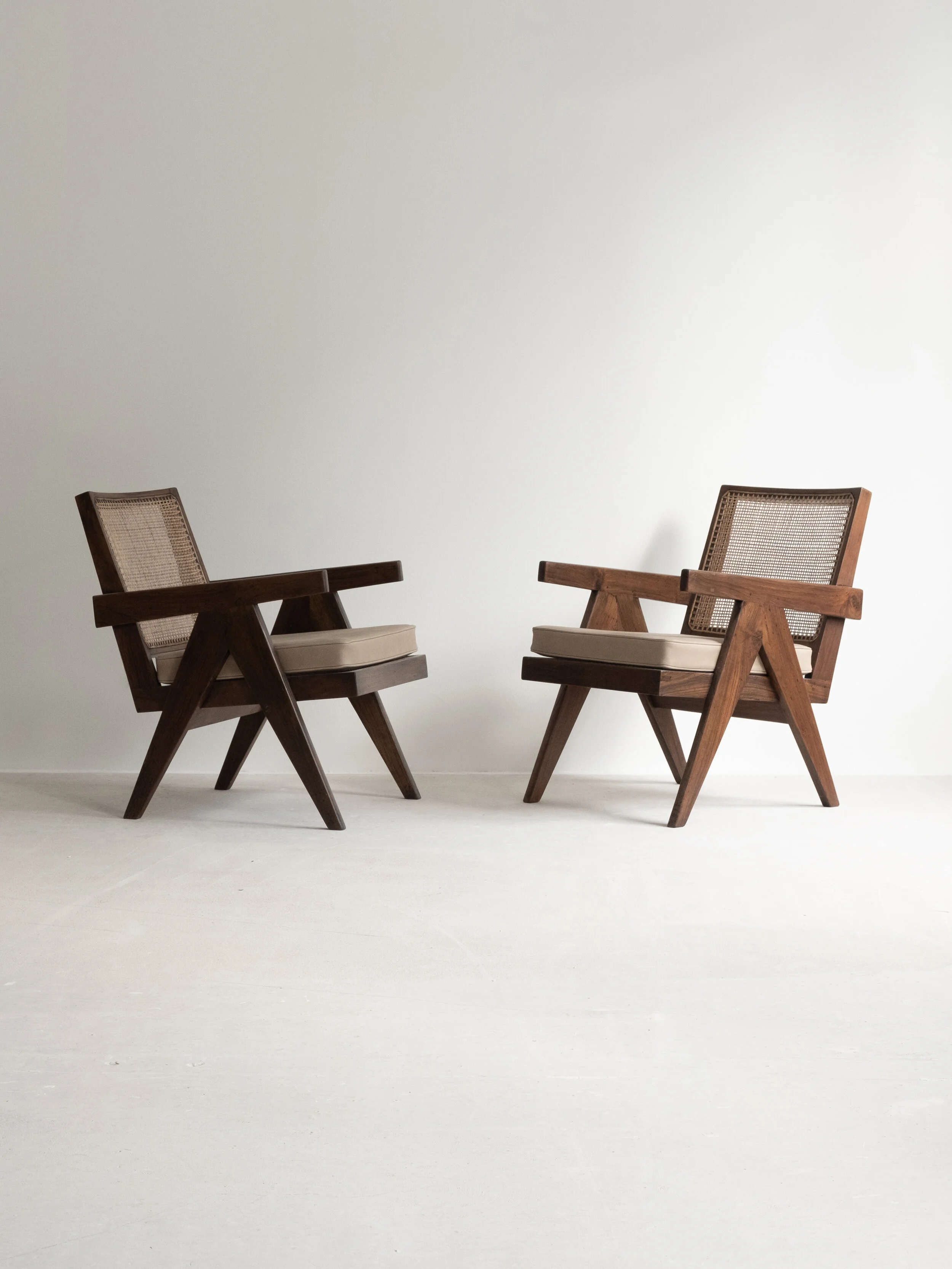 Vintage pair of Pierre Jeanneret “Easy Armchair” PJ-SI-29-A available at NICOLAI HECHT. Collectible, contemporary and vintage design available.