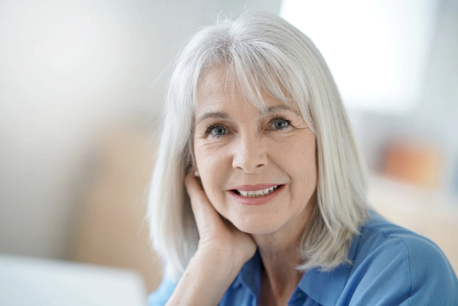 Senior lady smiling after smile makeover service