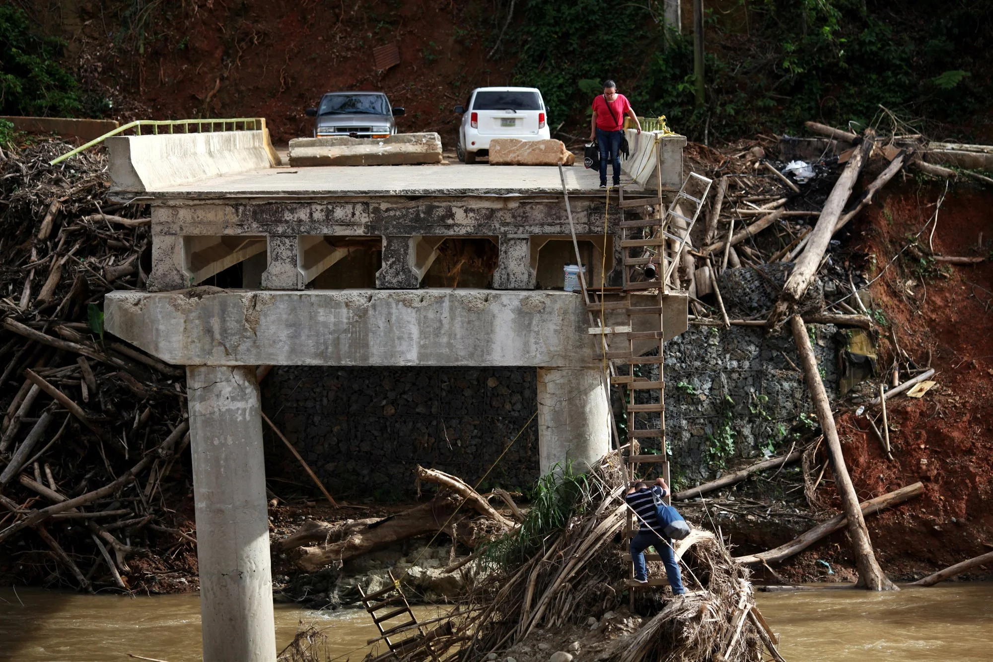 171120-puerto-rico-hurricane-maria-bridge-collapsed-sg-1321_407f5e3fe10f9e9c889c66fdc3a2c819.fit-2000w.jpg
