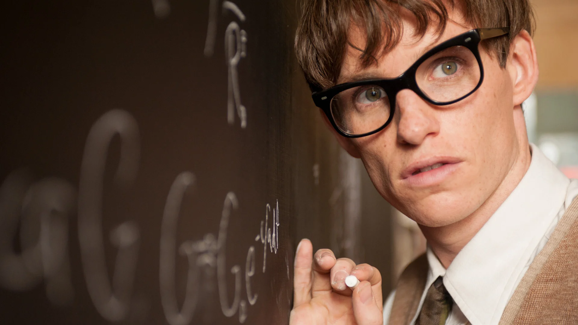 Stephen Hawking (Eddie Redmayne) works to prove that the size and shape of a rotating black hole depends on its mass and rate of rotation