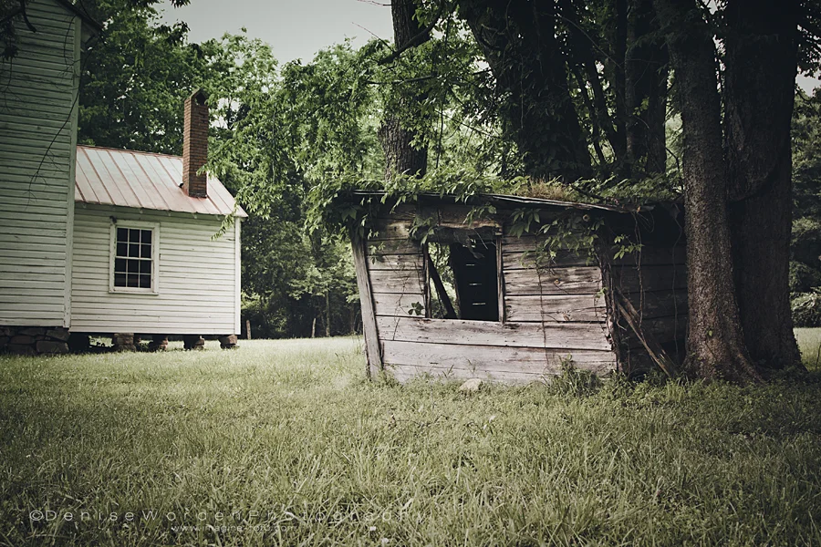 Small structure behind the main house, maybe a chicken coop?