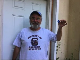 Steven holding the keys to his new home!