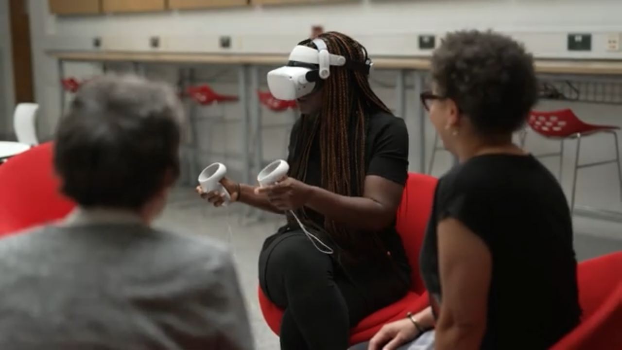 Juliana with VR headset with Stephani and Lucia.png