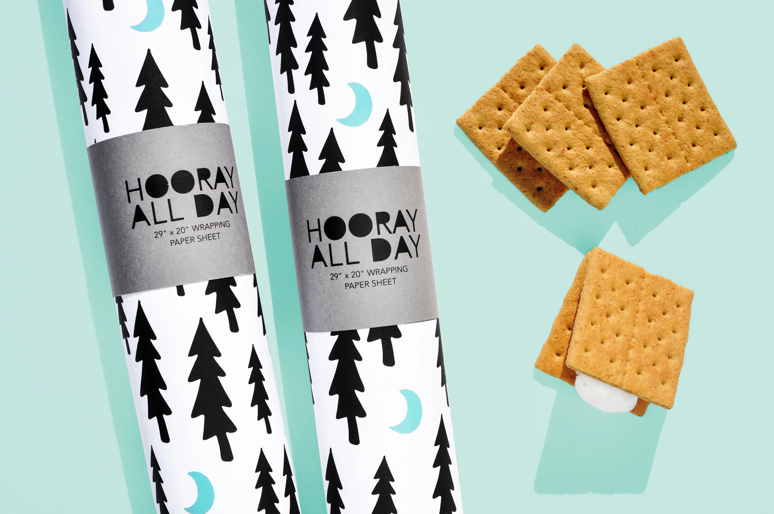 Trees + Moons Wrapping Paper Product Shot Two Rolls with Smores.jpg