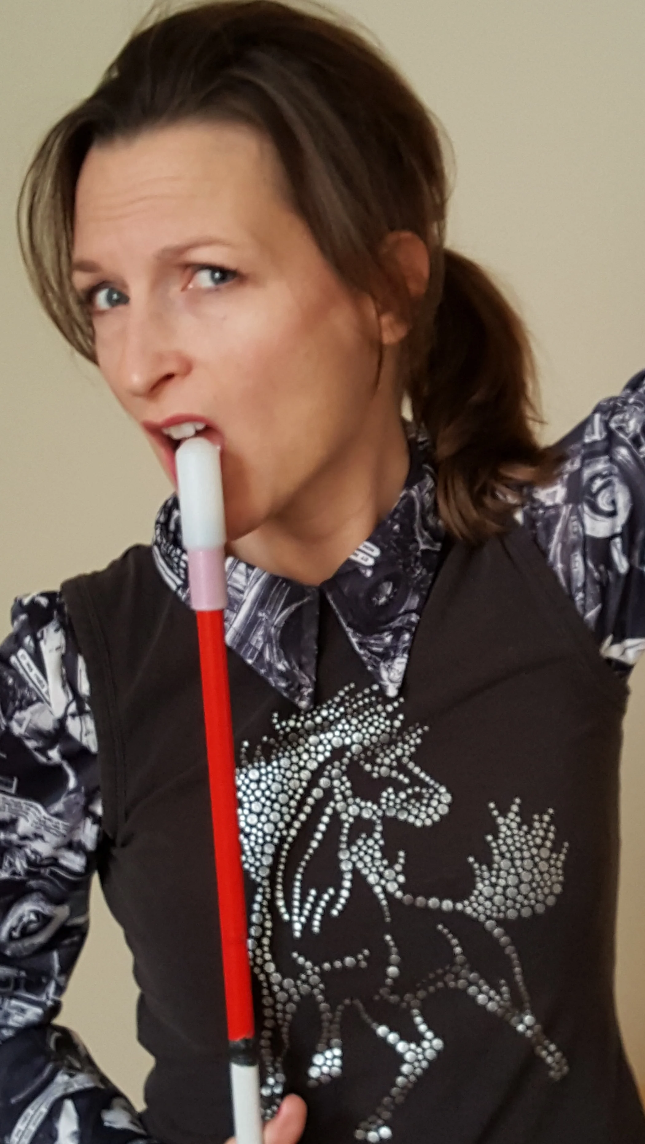 Rockstar Bella using her cane as a microphone.