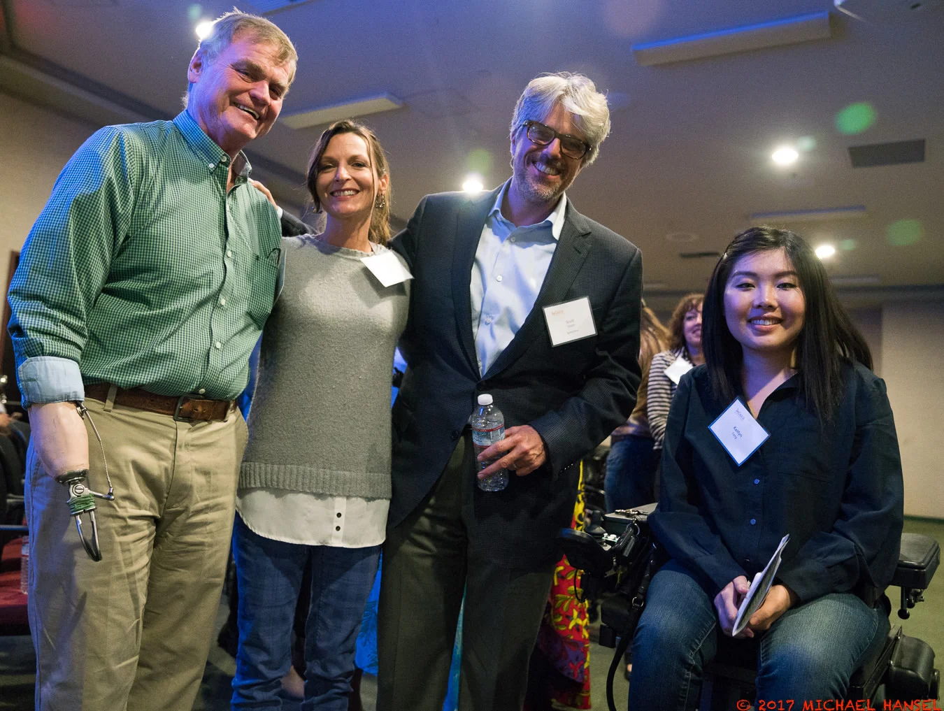 Bella in a frumpy sweater that she will never wear again, at an event with John Lawson and Scott Silveri, and one new friend.