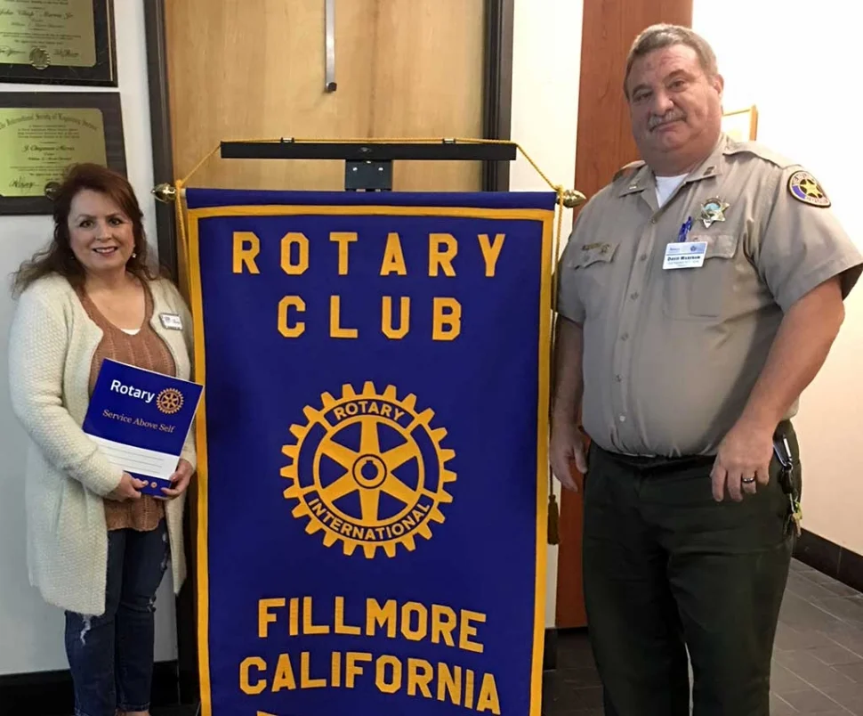 Rotary Club welcomed their newest member Theresa Robledo with open arms as she smiles for a photo with Rotary Club President Dave Wareham. Photo Courtesy Martha Richardson.