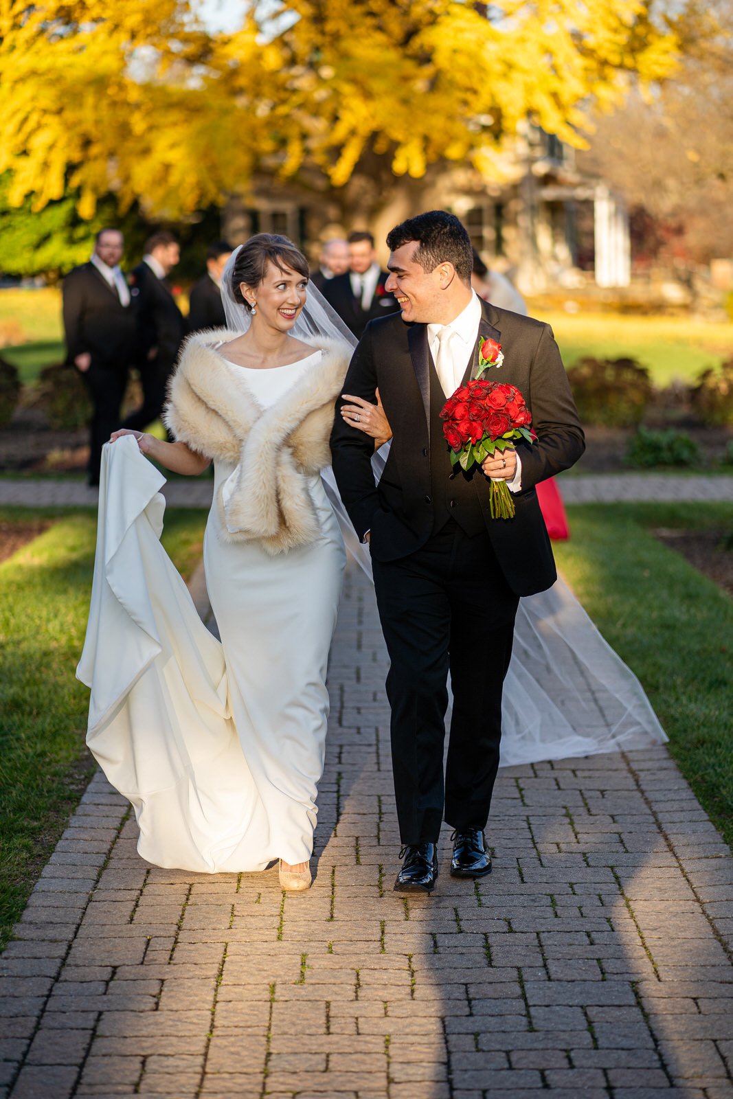 A newlywed couple walks through a garden in Allentown PA