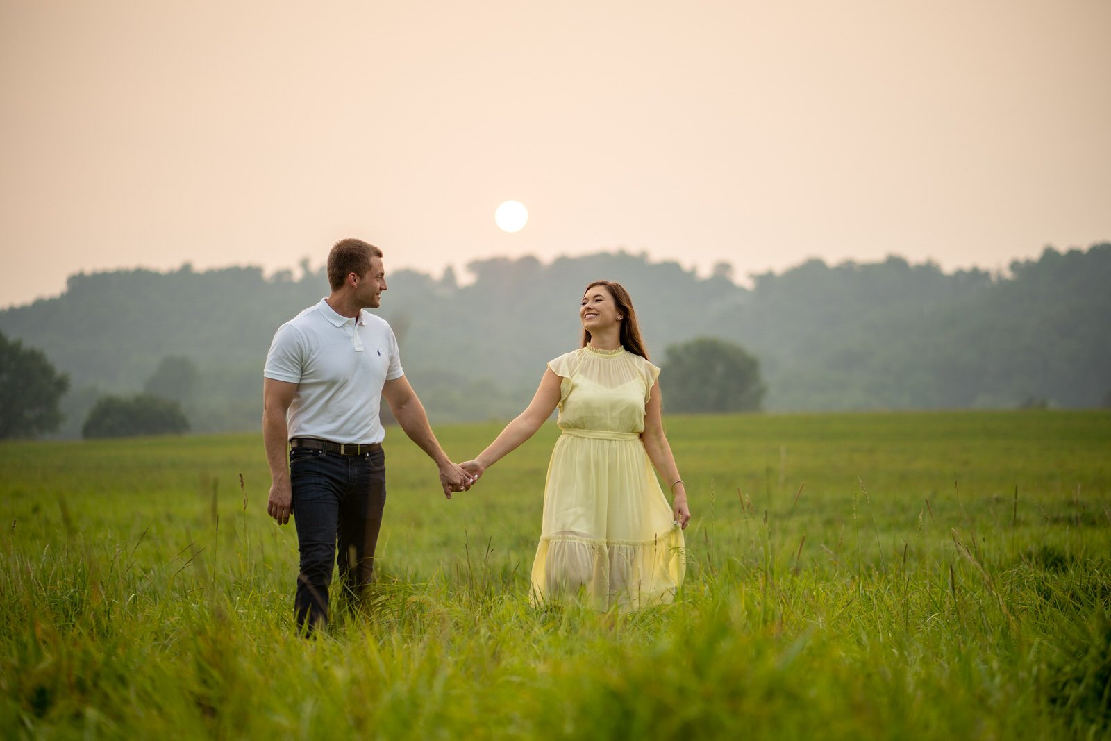 Two farmers, who happen to be doctors, hold hands on their farm in Elizabethtown PA