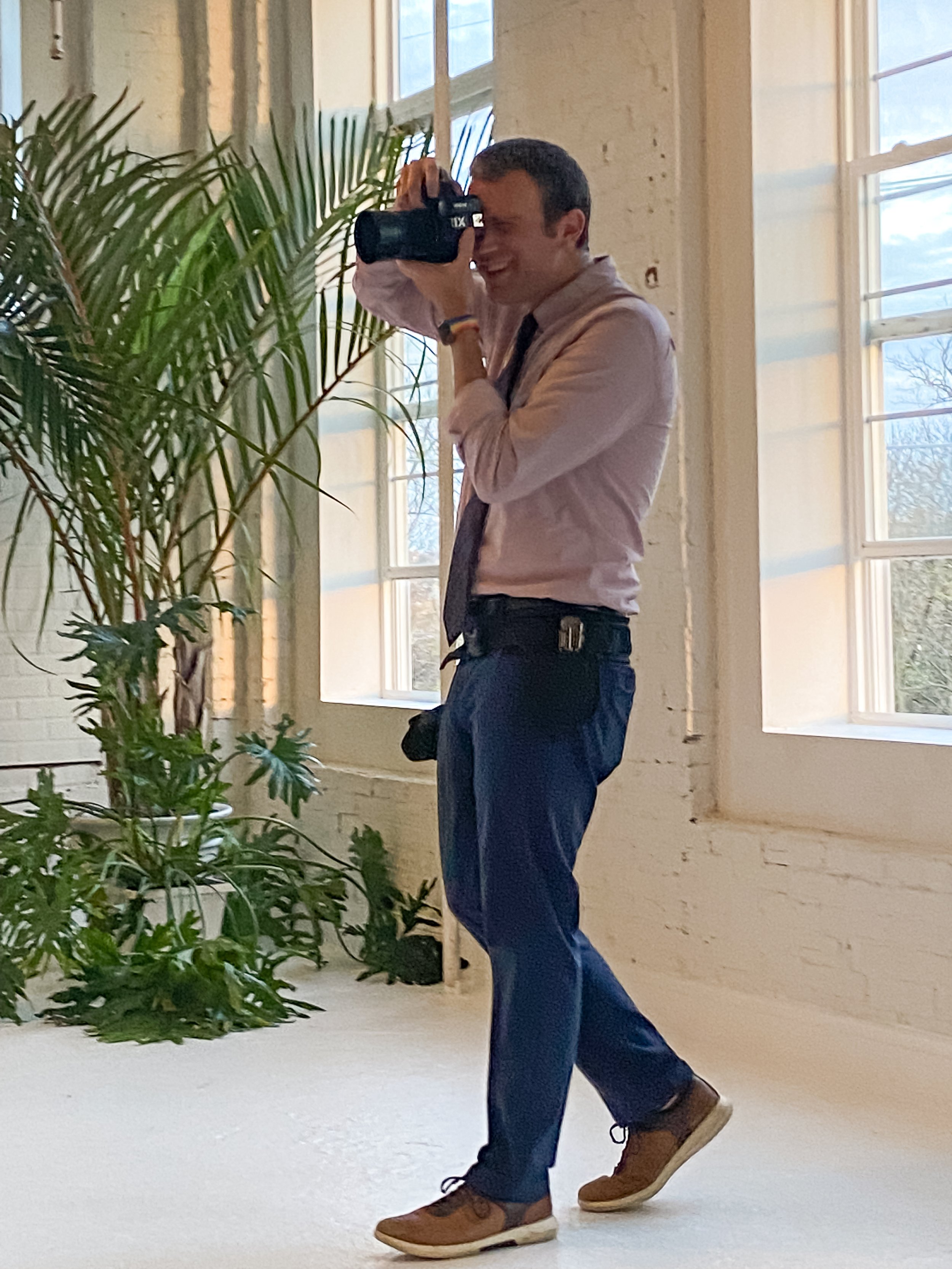 Colin Hayden Photo taking pictures during the first dance at a wedding at Maximalist Studios in Norristown PA