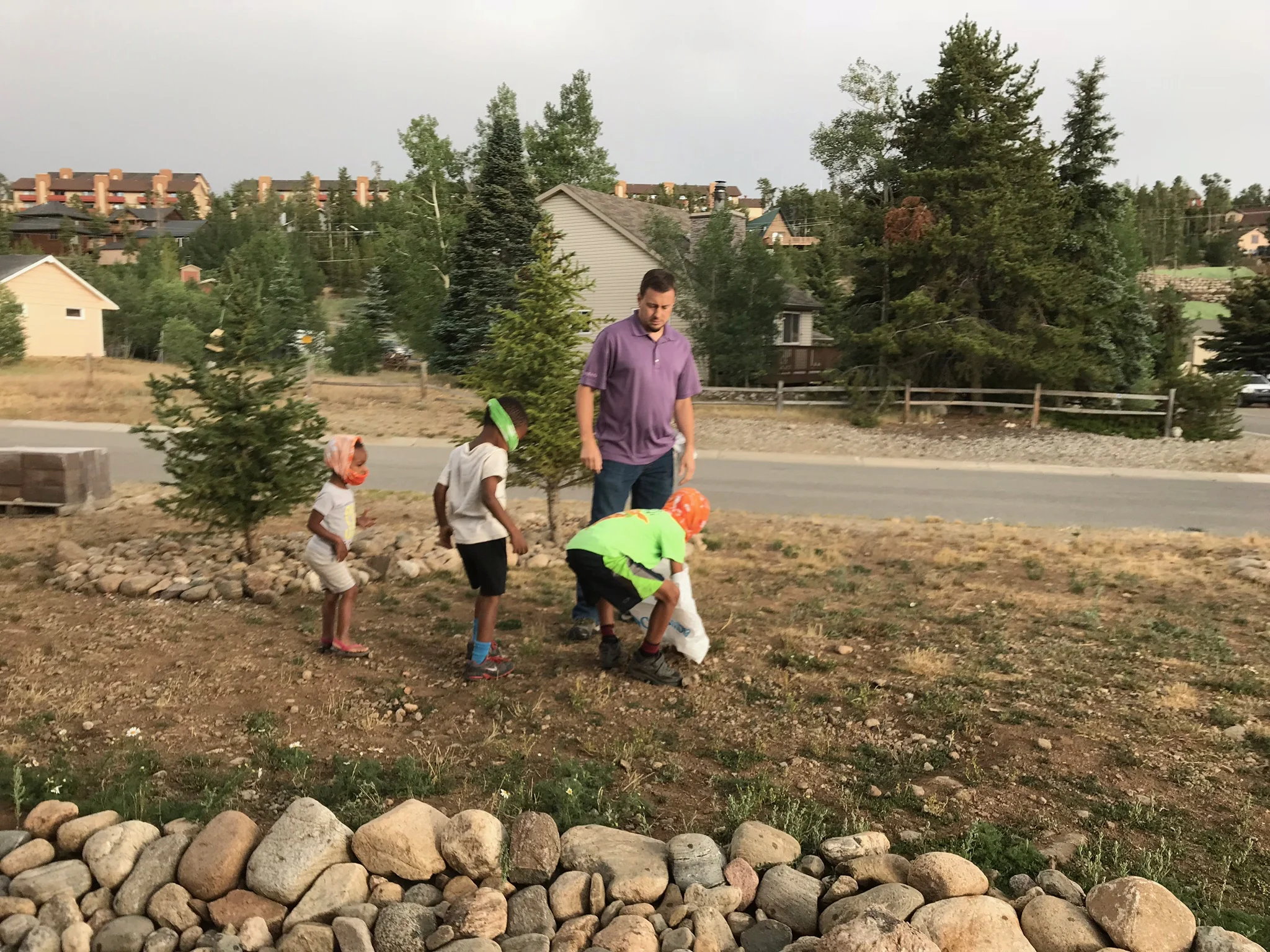 ....much to the dismay of Isaac and CJ! They quickly negotiated another $5.00 prize for themselves if they would retrieve it...so they practiced picking up a rock without touching it, and after succeeding they headed back in to pick up the real thing.