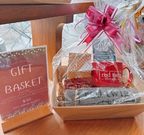 A Red Twig Cafe gift basket with several items