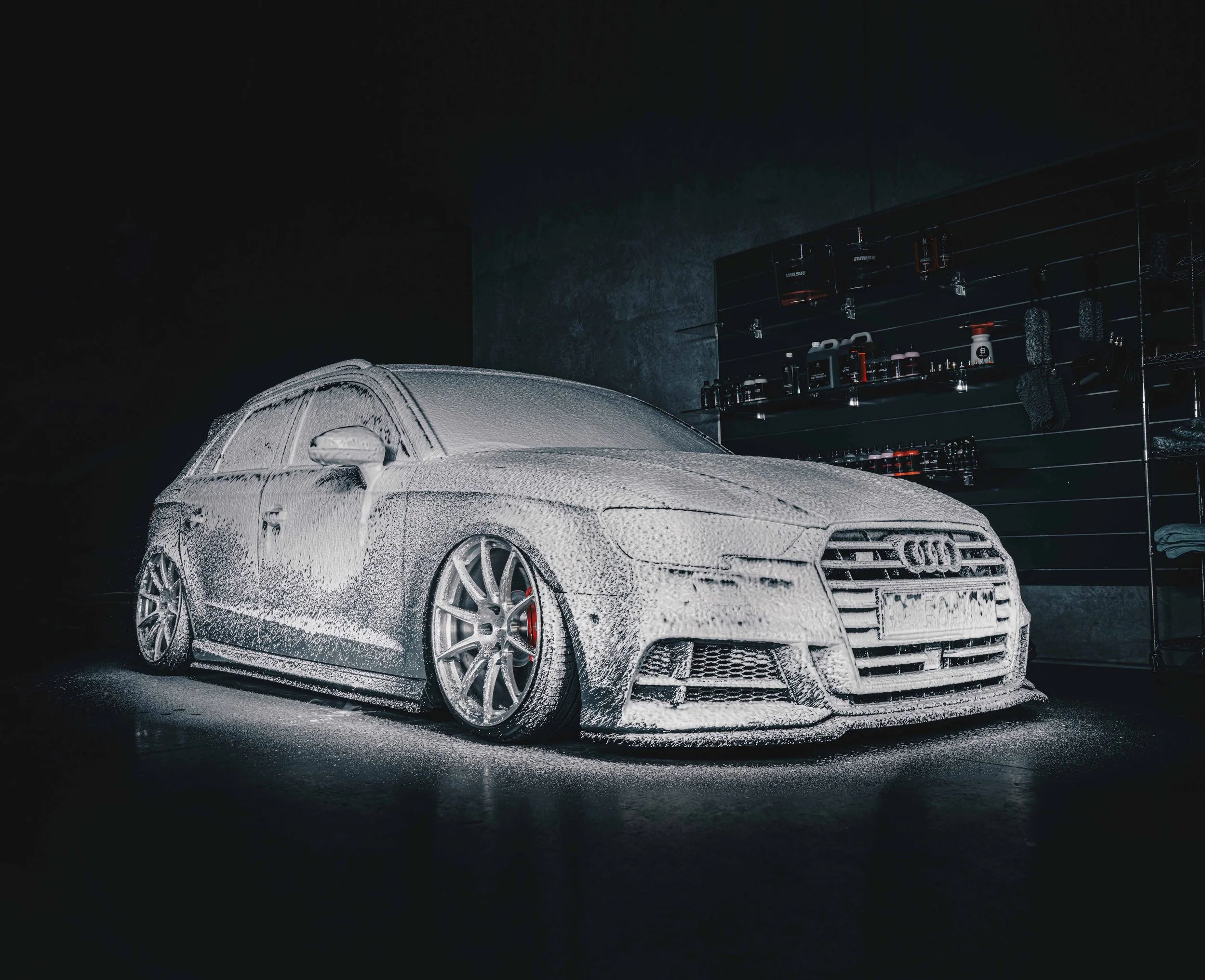 Audi RS3 completely covered in thick snow foam during a mobile hand wash by Shibbi Automotive Care in Rose Bay, Sydney. Foam pre-wash dwells before hand agitation to safely lift dirt and prevent scratches.
