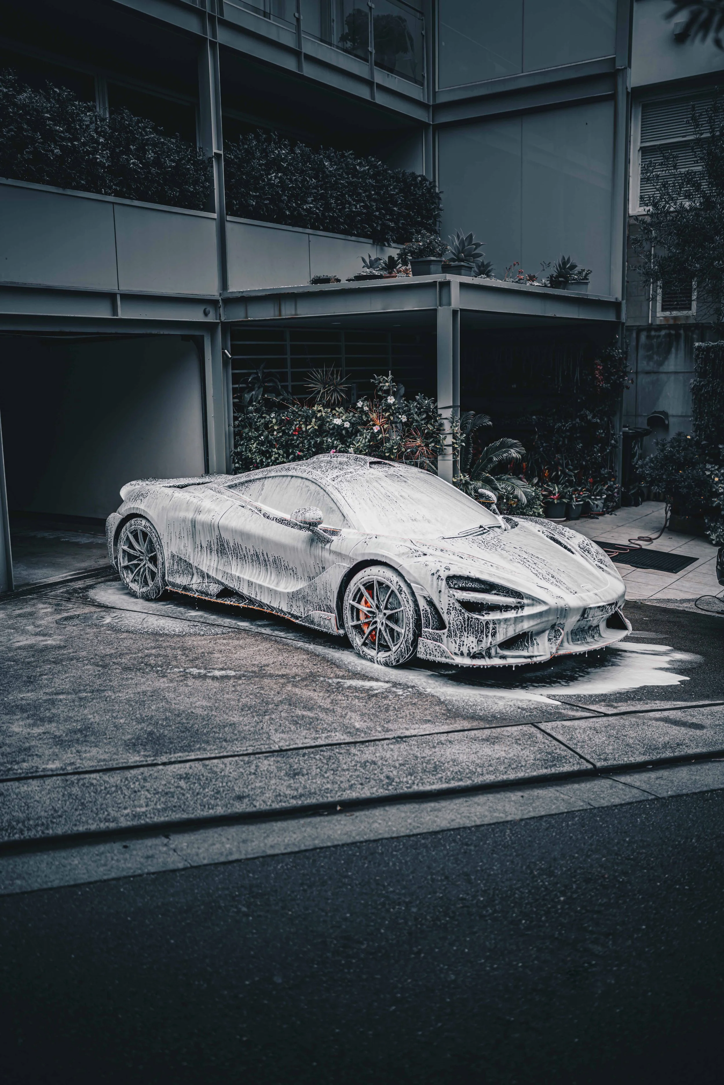 Shibbi Car Detail mobile car detailing performing a full exterior and interior detail on a mclaren 765ltin a customer's driveway in Sydney.
